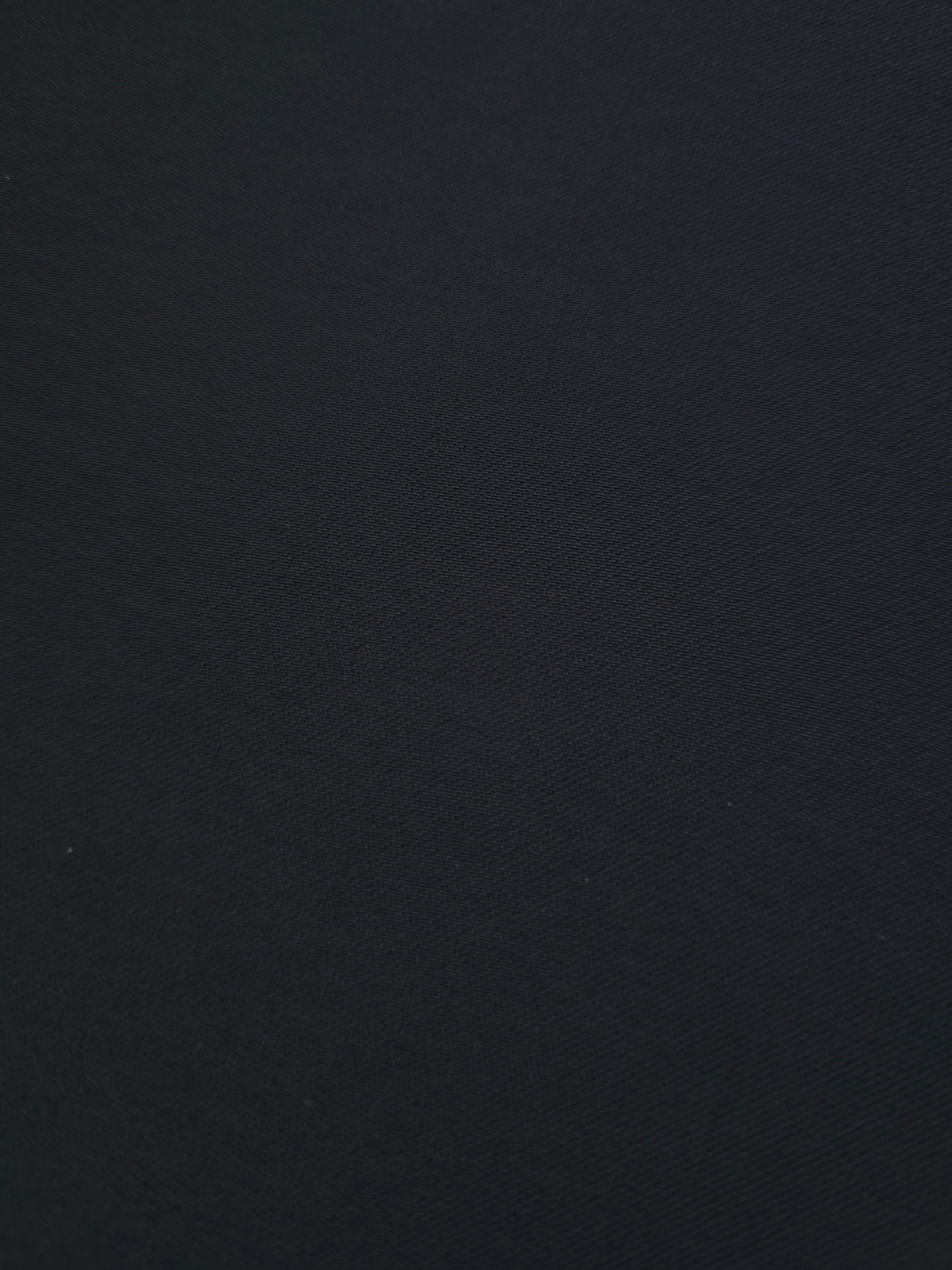 Close-up Ink Blue Black Silky Italian Crepe showing its fine woven texture and soft hand, ideal for abayas, tunics and elegant shirt dresses.