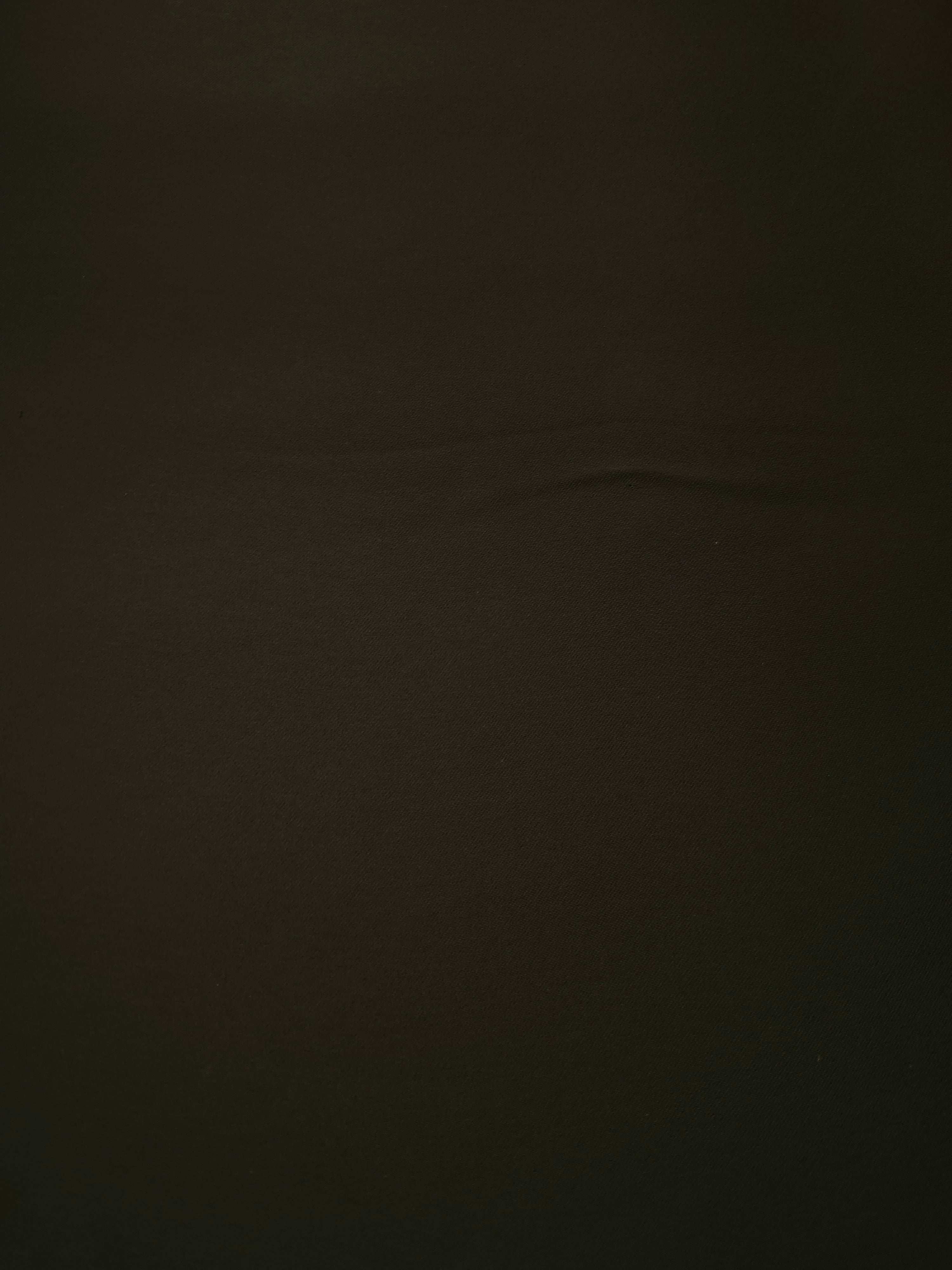 Ink Olive Black Silky Italian Crepe with a smooth opaque finish, suitable for bridesmaid dresses, blouses and refined separates.