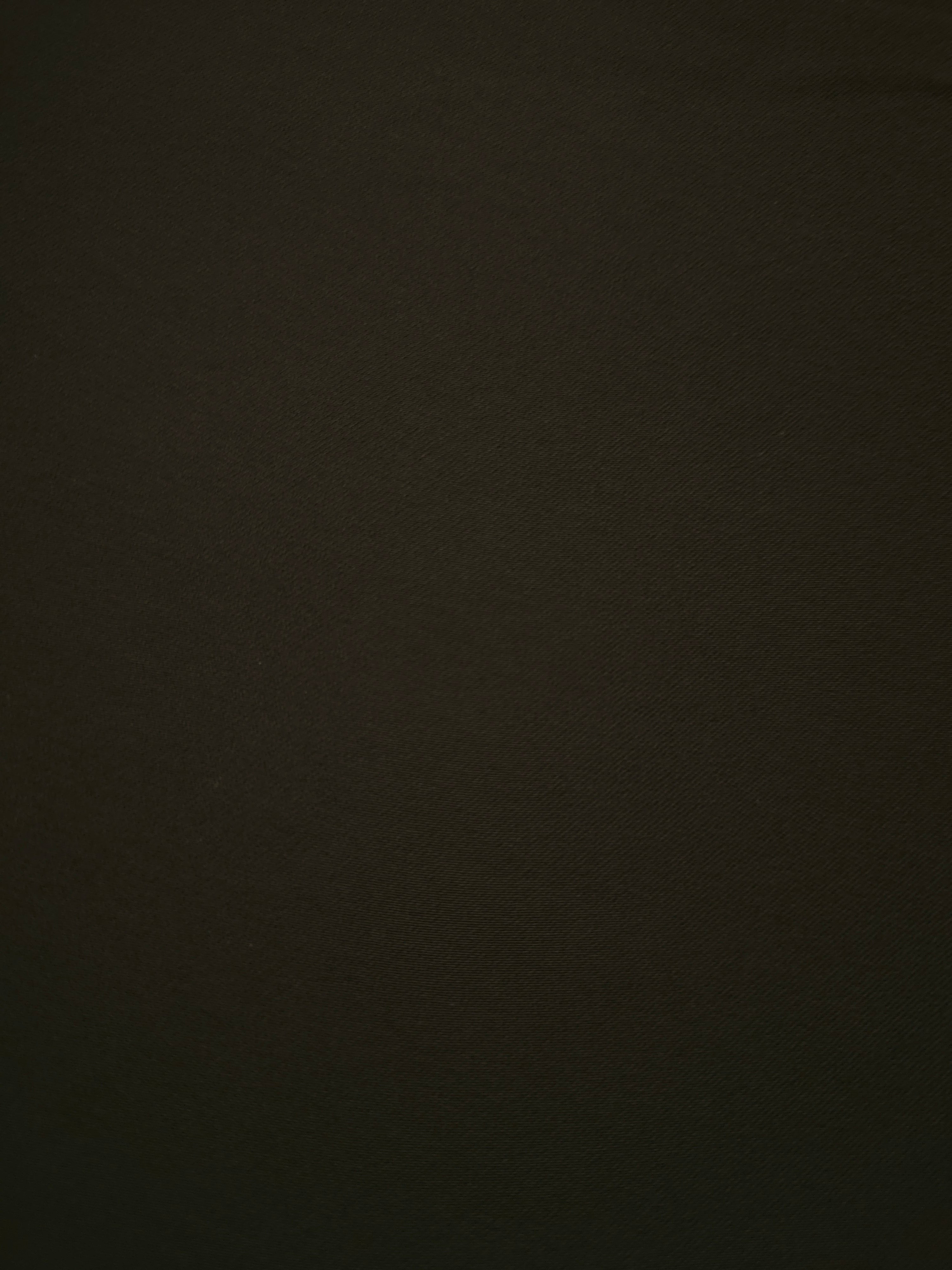 Close-up Ink Olive Black Silky Italian Crepe showing its fine woven texture and soft hand, ideal for wrap dresses, wide-leg trousers and dressy co-ords.