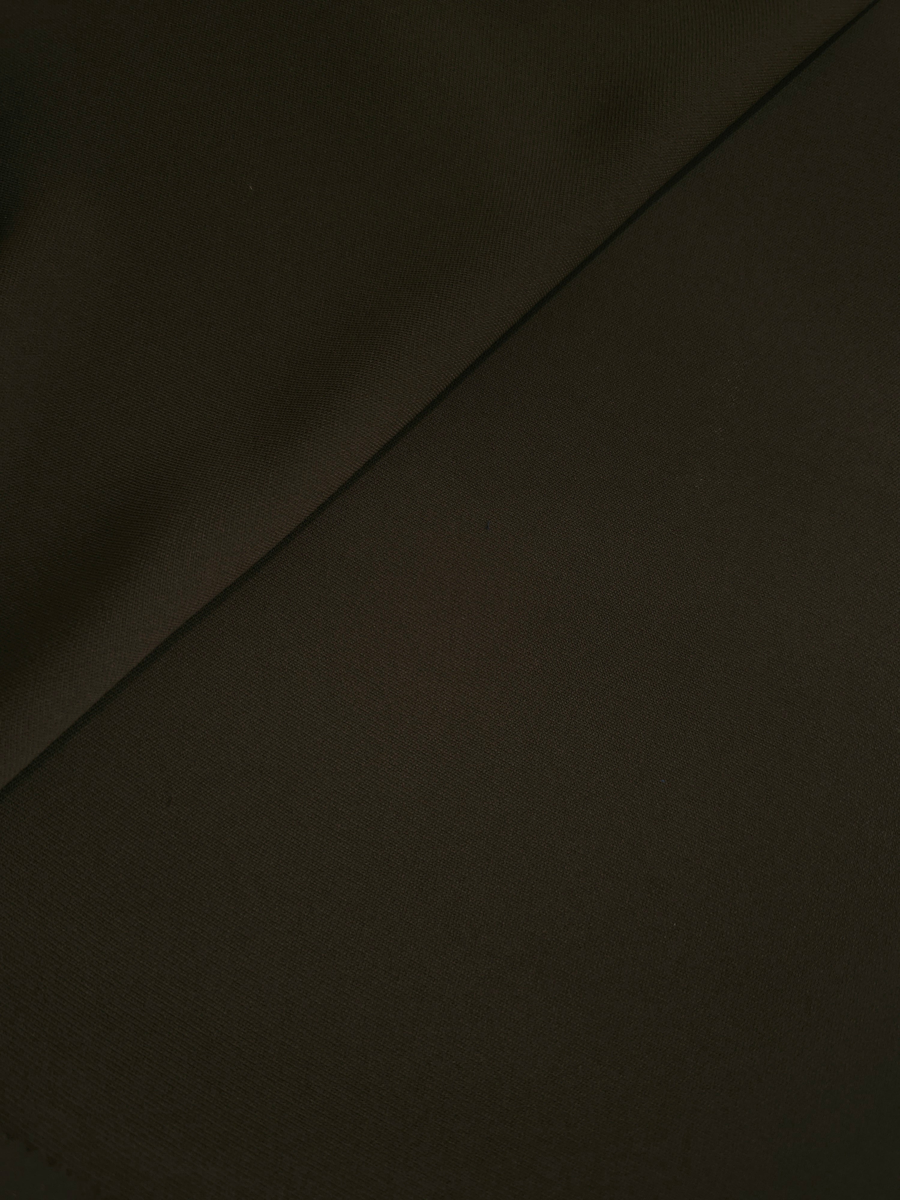 Soft-fold Ink Olive Black Silky Italian Crepe showing fluid drape through soft folds, suited to formal gowns, abayas and special-occasion skirts.