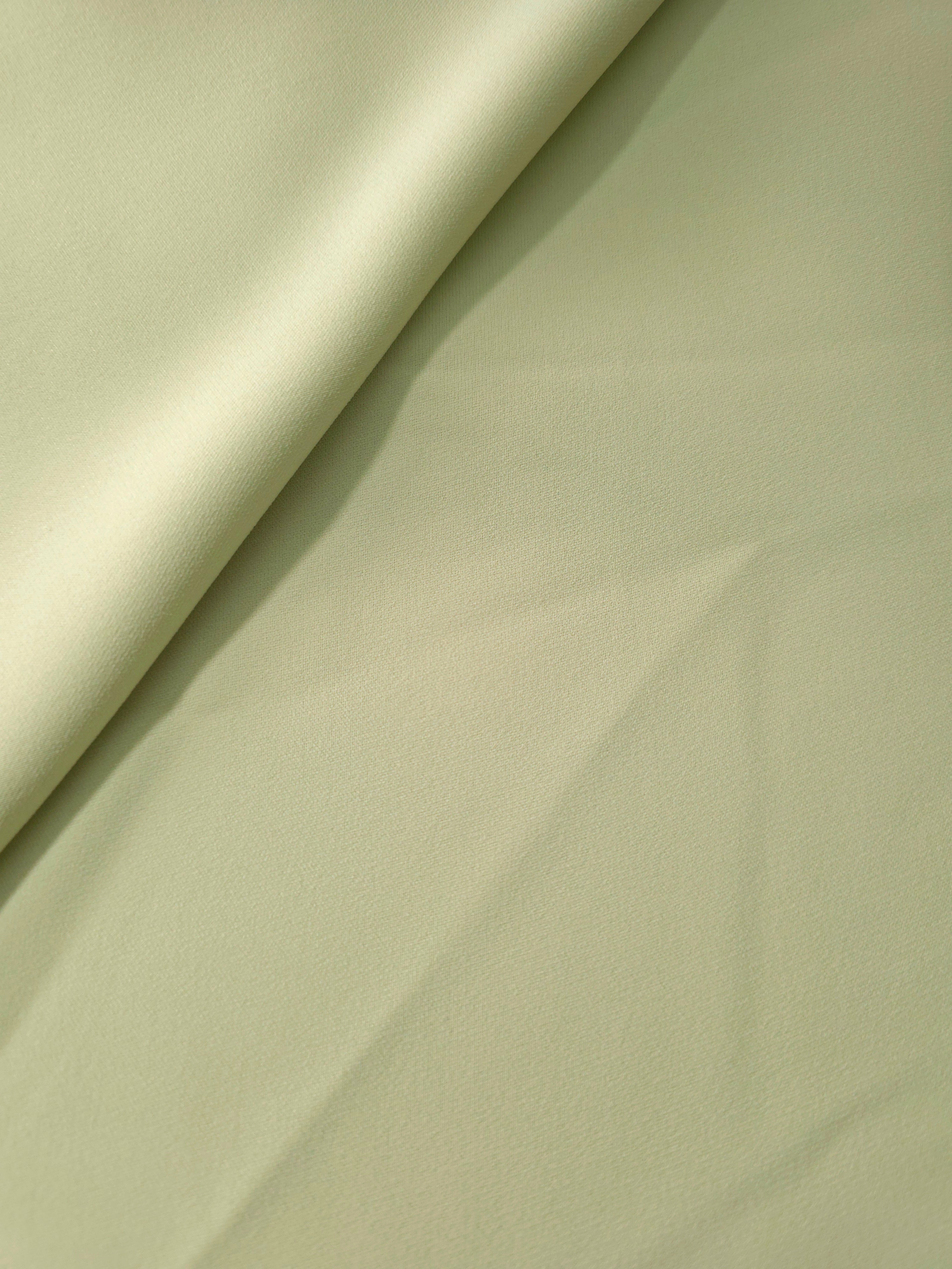 Soft-fold Linden Cream Silky Italian Crepe showing fluid drape through soft folds, suited to bridesmaid dresses, blouses and refined separates.