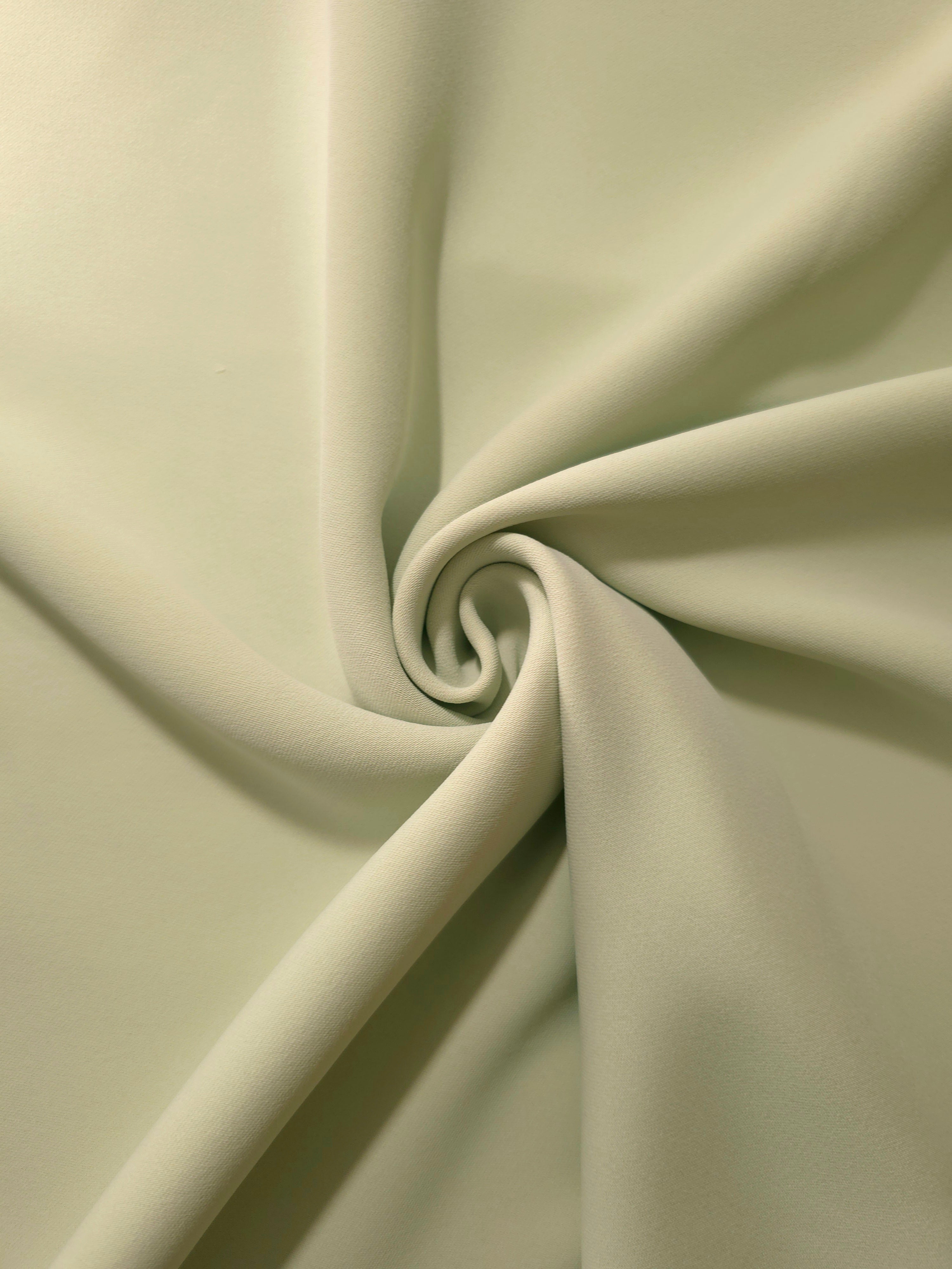 Layered Linden Cream Silky Italian Crepe showing soft structure in layered folds, suitable for office blouses, tailored dresses and soft jackets.