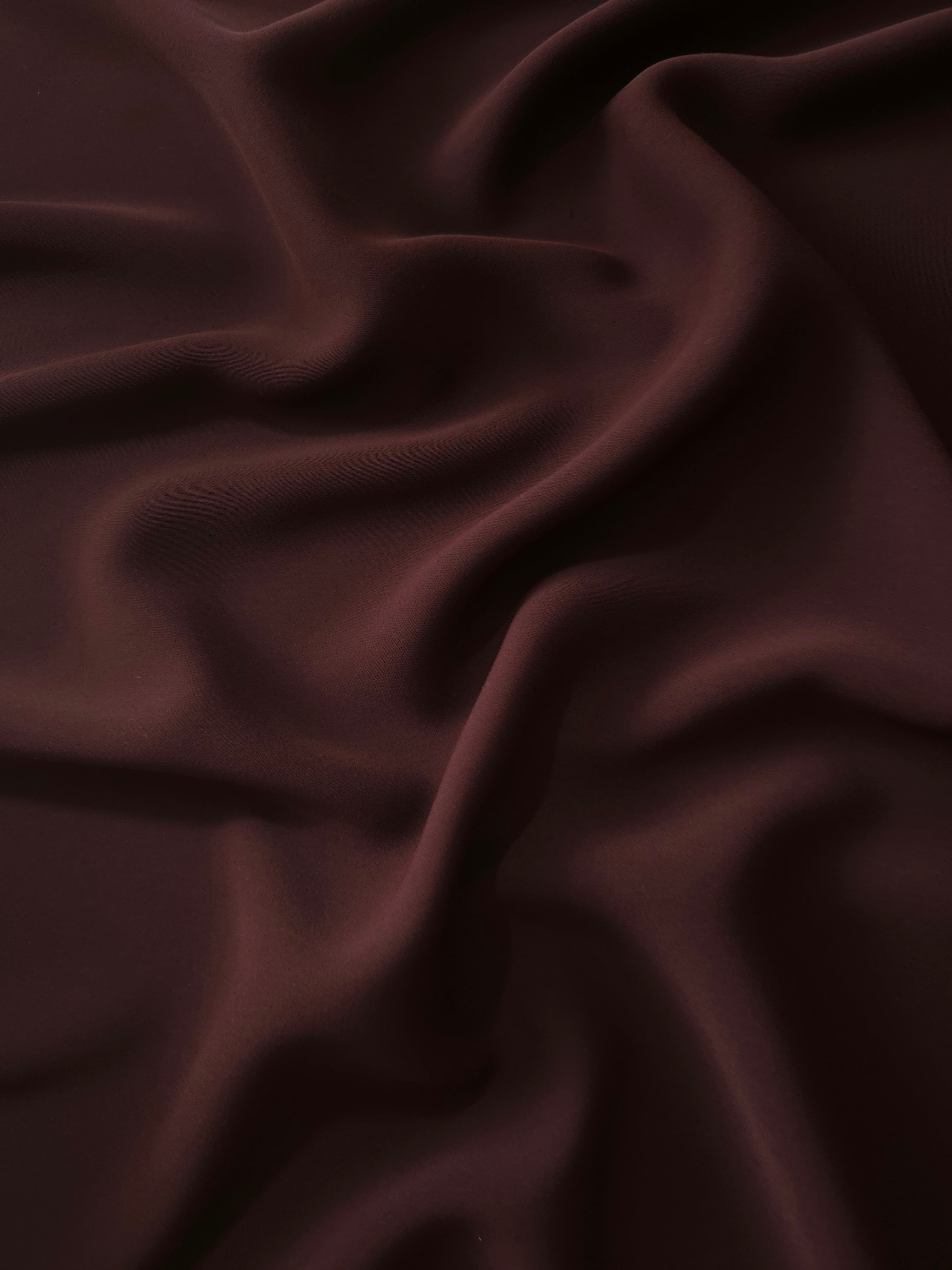 Draped Mulberry Merlot Silky Italian Crepe showing an elegant fall through draped folds, ideal for occasion gowns, tunics and lightweight tailored pieces.