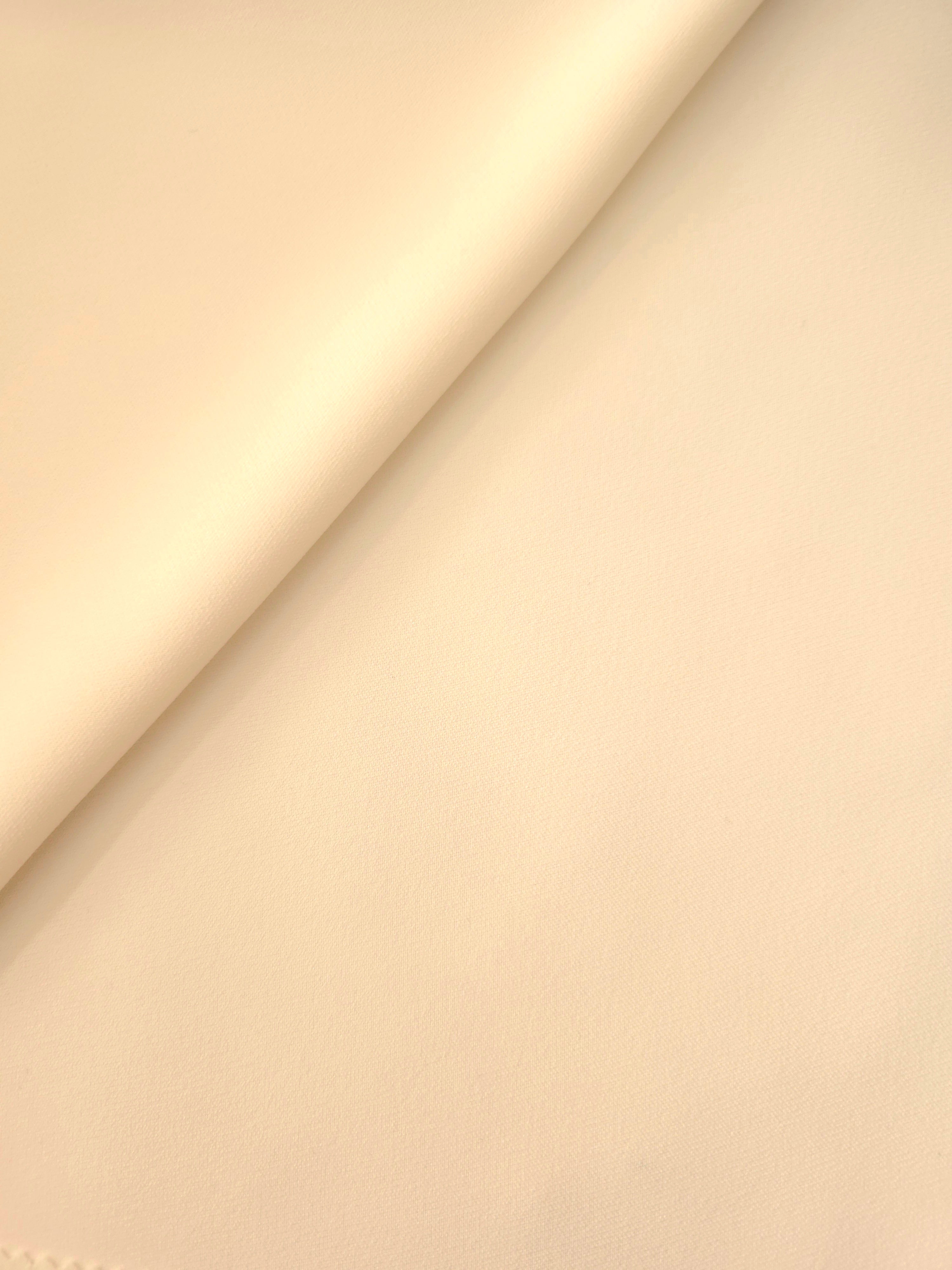Soft-fold Oat Almond Cream Silky Italian Crepe showing fluid drape through soft folds, suited to kaftans, long skirts and fluid occasionwear.