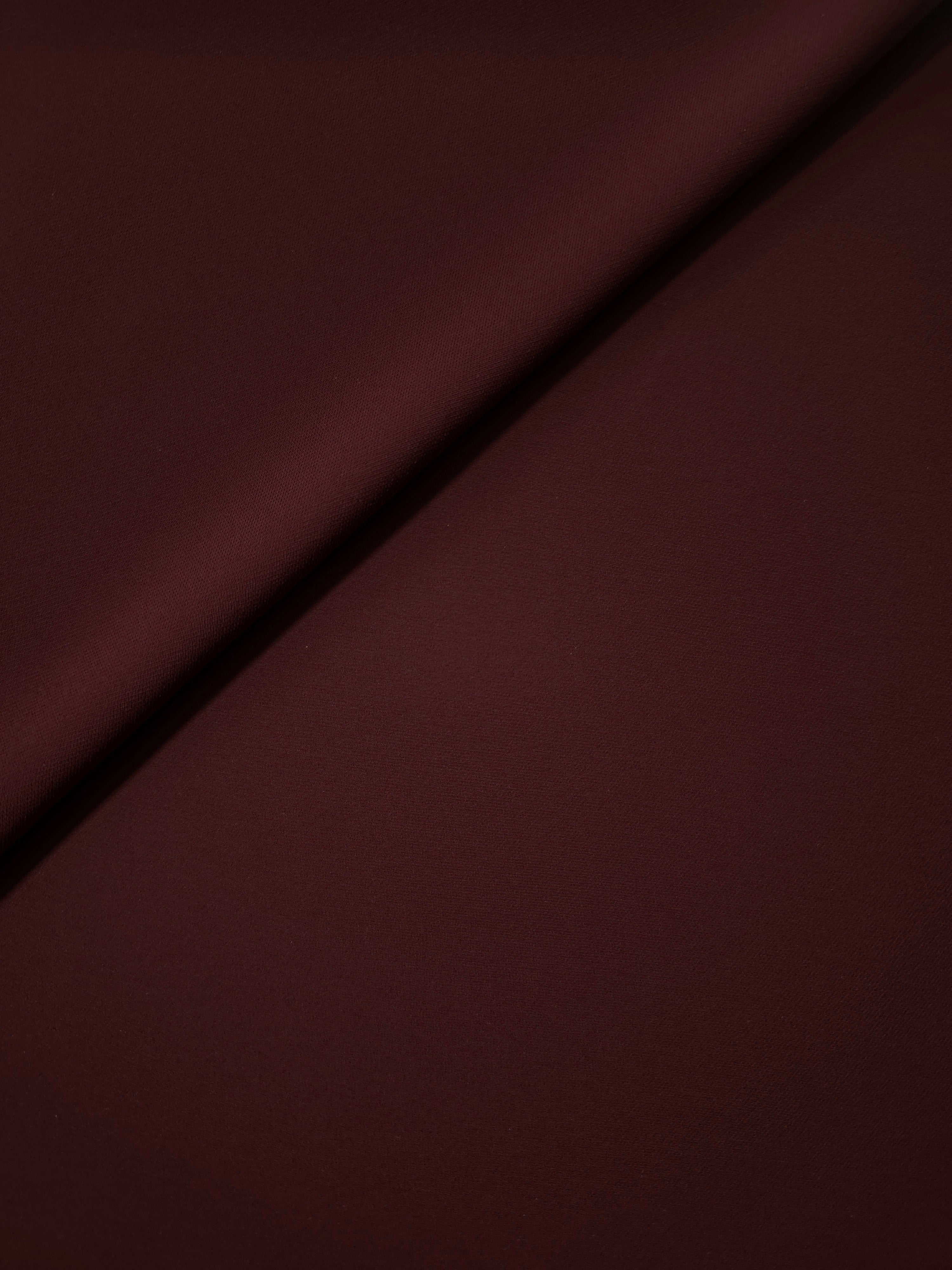 Soft-fold Oxblood Cocoa Silky Italian Crepe showing fluid drape through soft folds, suited to blouses, midi skirts and modest dresses.
