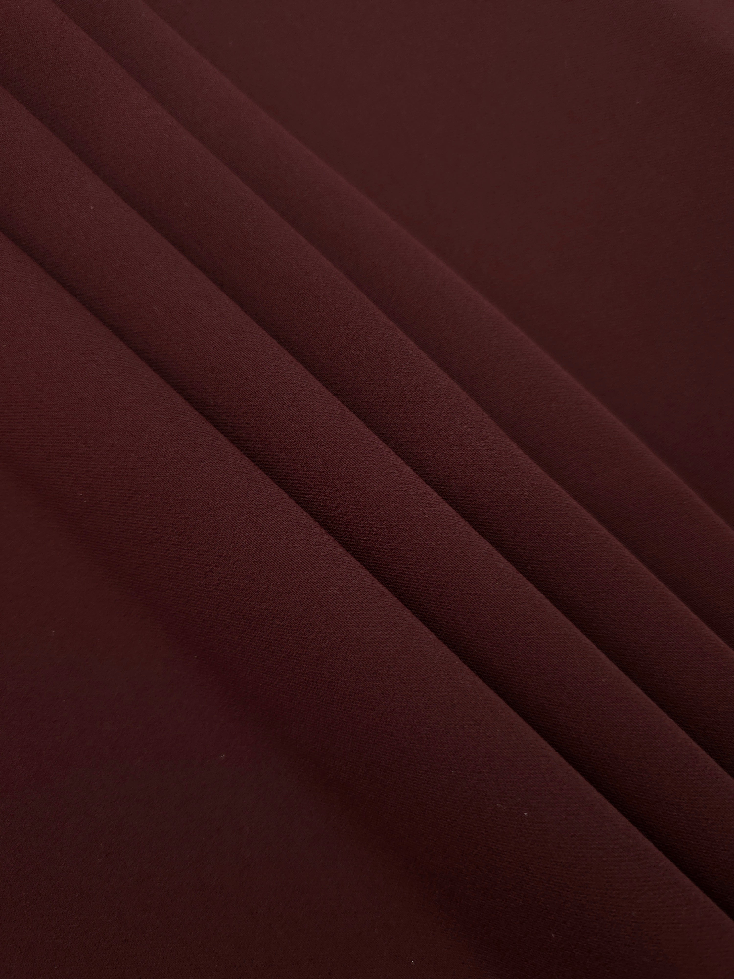 Layered Oxblood Cocoa Silky Italian Crepe showing soft structure in layered folds, suitable for maxi dresses, modest sets and lightweight tailoring.