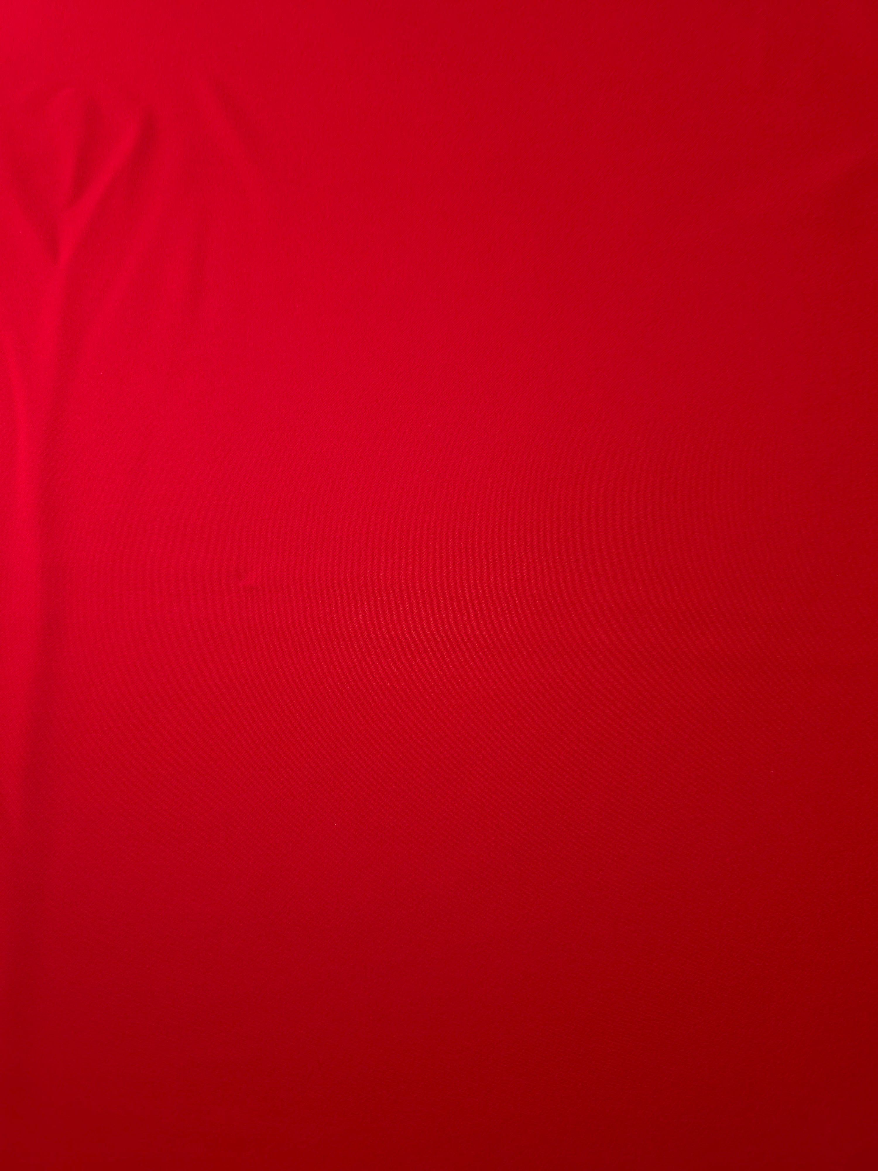 Poppy Scarlet Silky Italian Crepe with a smooth opaque finish, suitable for evening dresses, flowing skirts and occasionwear tops.