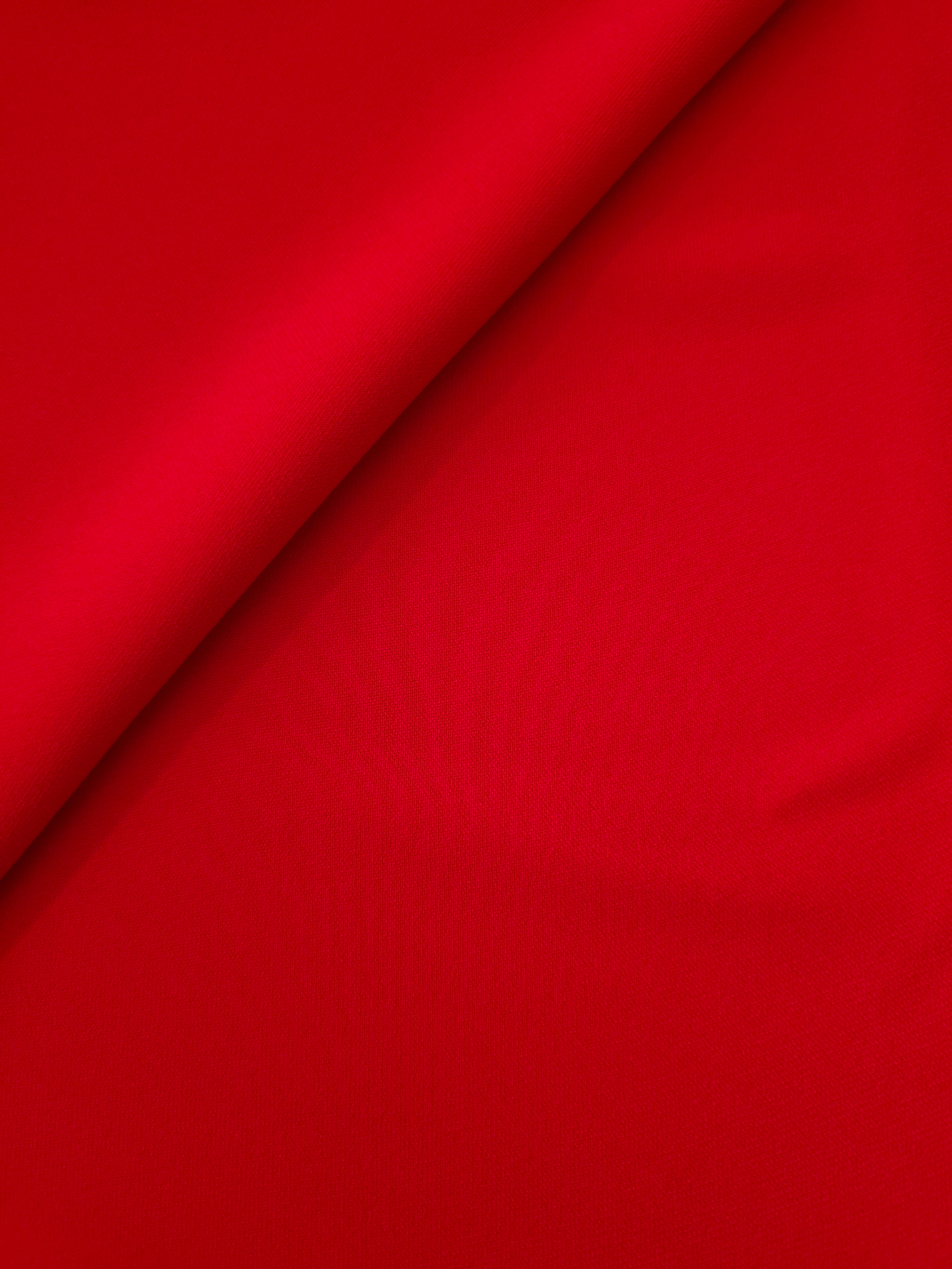Soft-fold Poppy Scarlet Silky Italian Crepe showing fluid drape through soft folds, suited to bridesmaid dresses, blouses and refined separates.