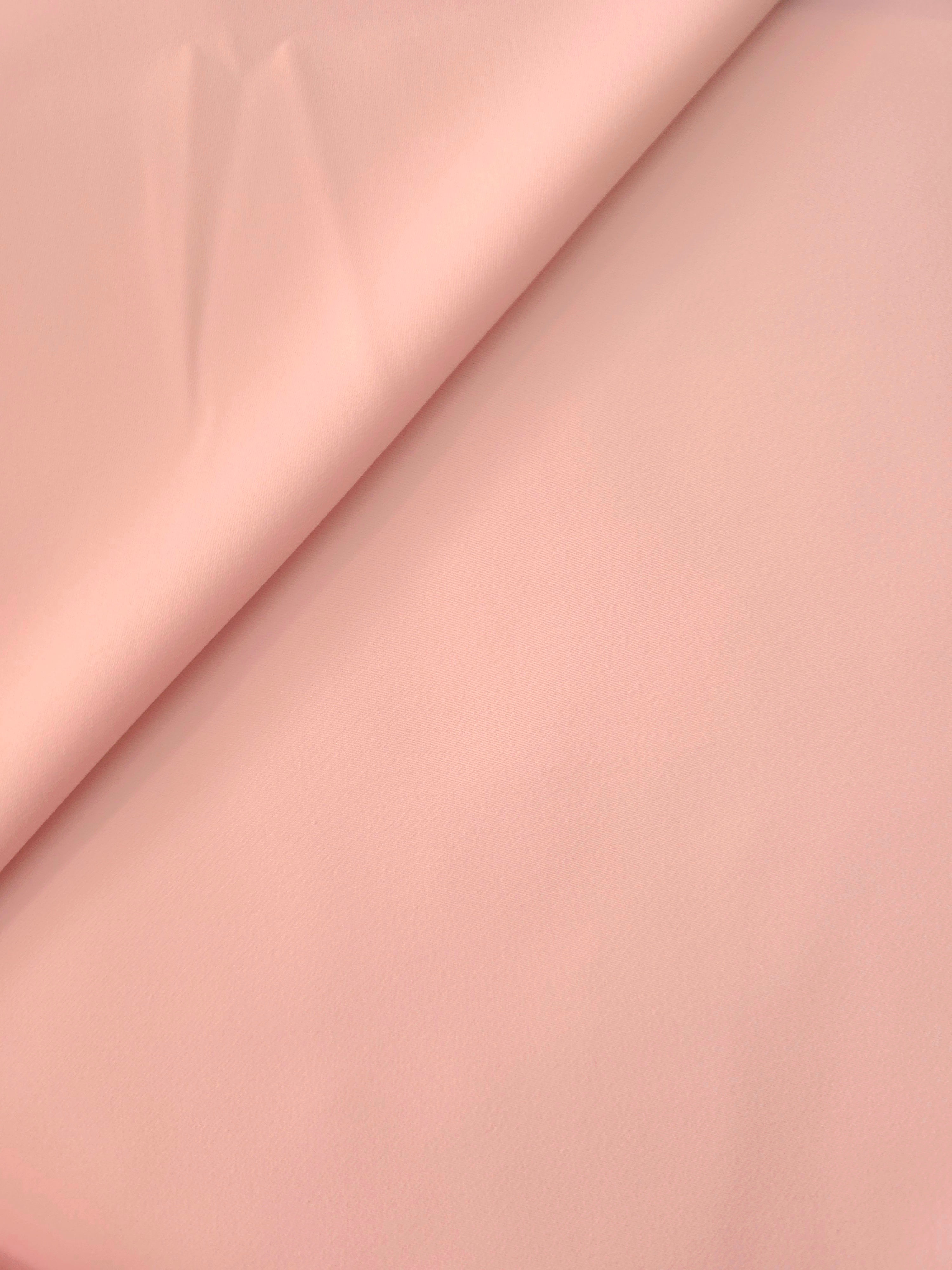 Soft-fold Rosewater Peach Silky Italian Crepe showing fluid drape through soft folds, suited to evening dresses, flowing skirts and occasionwear tops.
