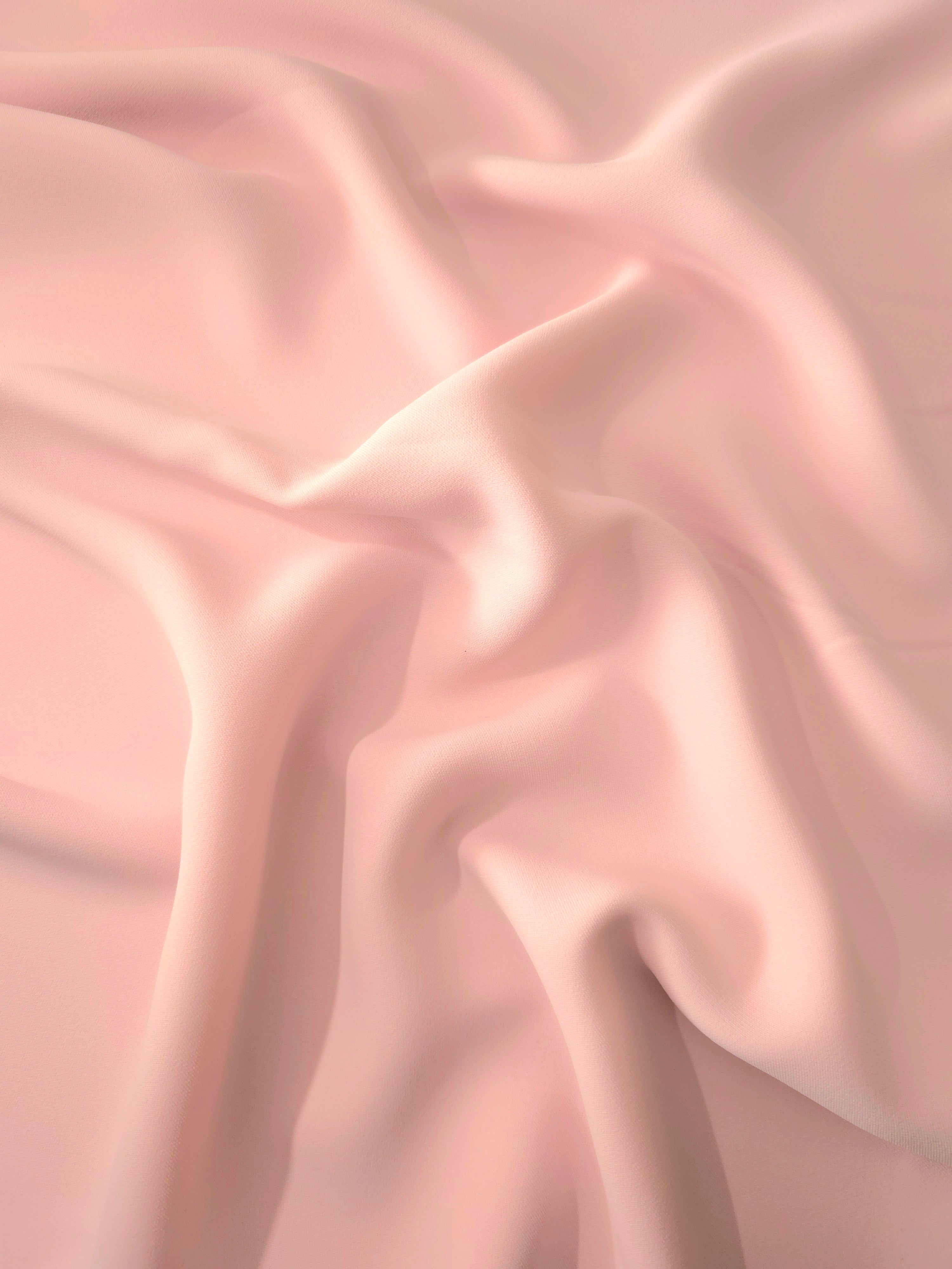Draped Rosewater Peach Silky Italian Crepe showing an elegant fall through draped folds, ideal for maxi dresses, modest sets and lightweight tailoring.