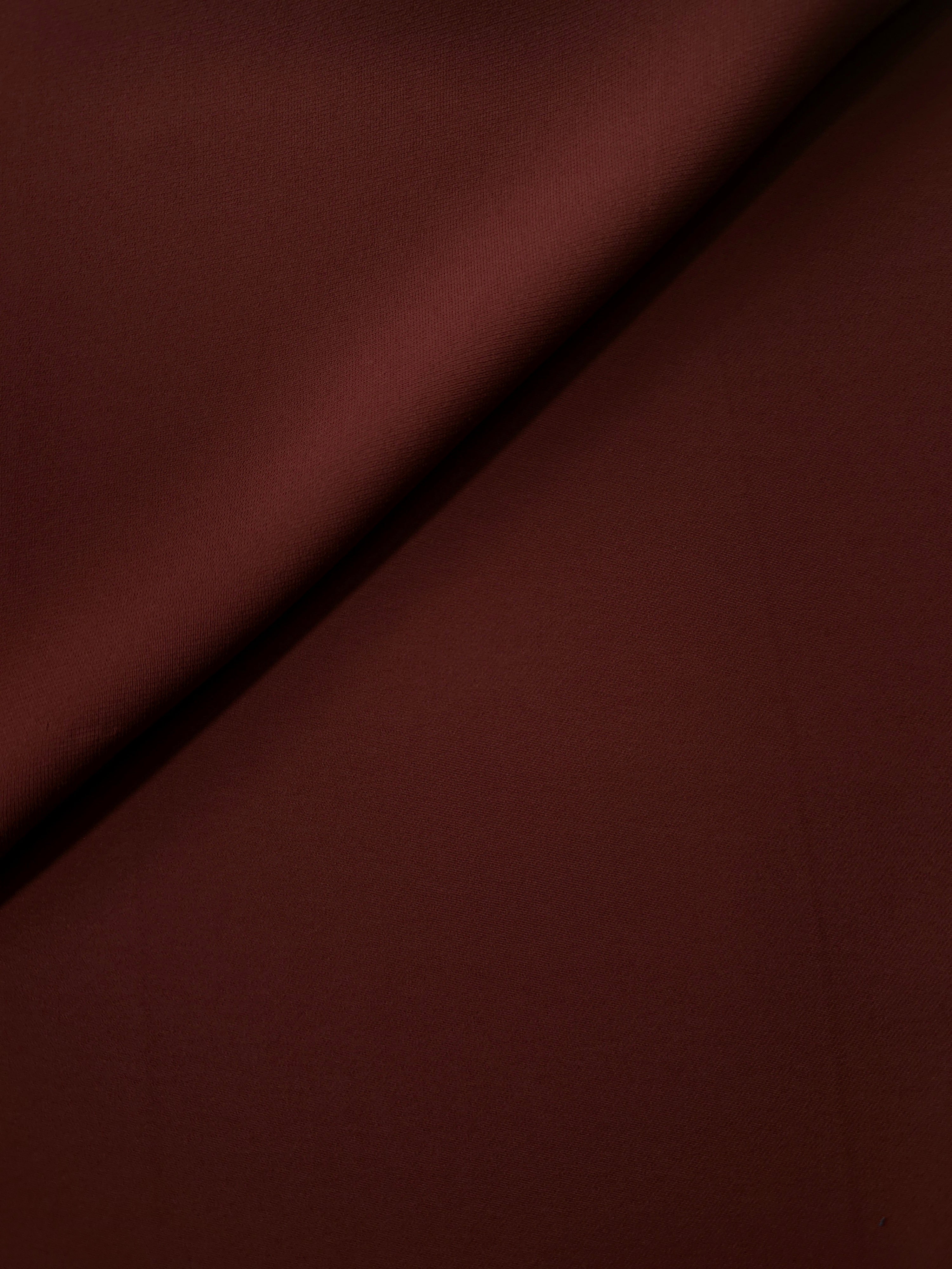 Soft-fold Russet Mahogany Silky Italian Crepe showing fluid drape through soft folds, suited to bridesmaid dresses, blouses and refined separates.