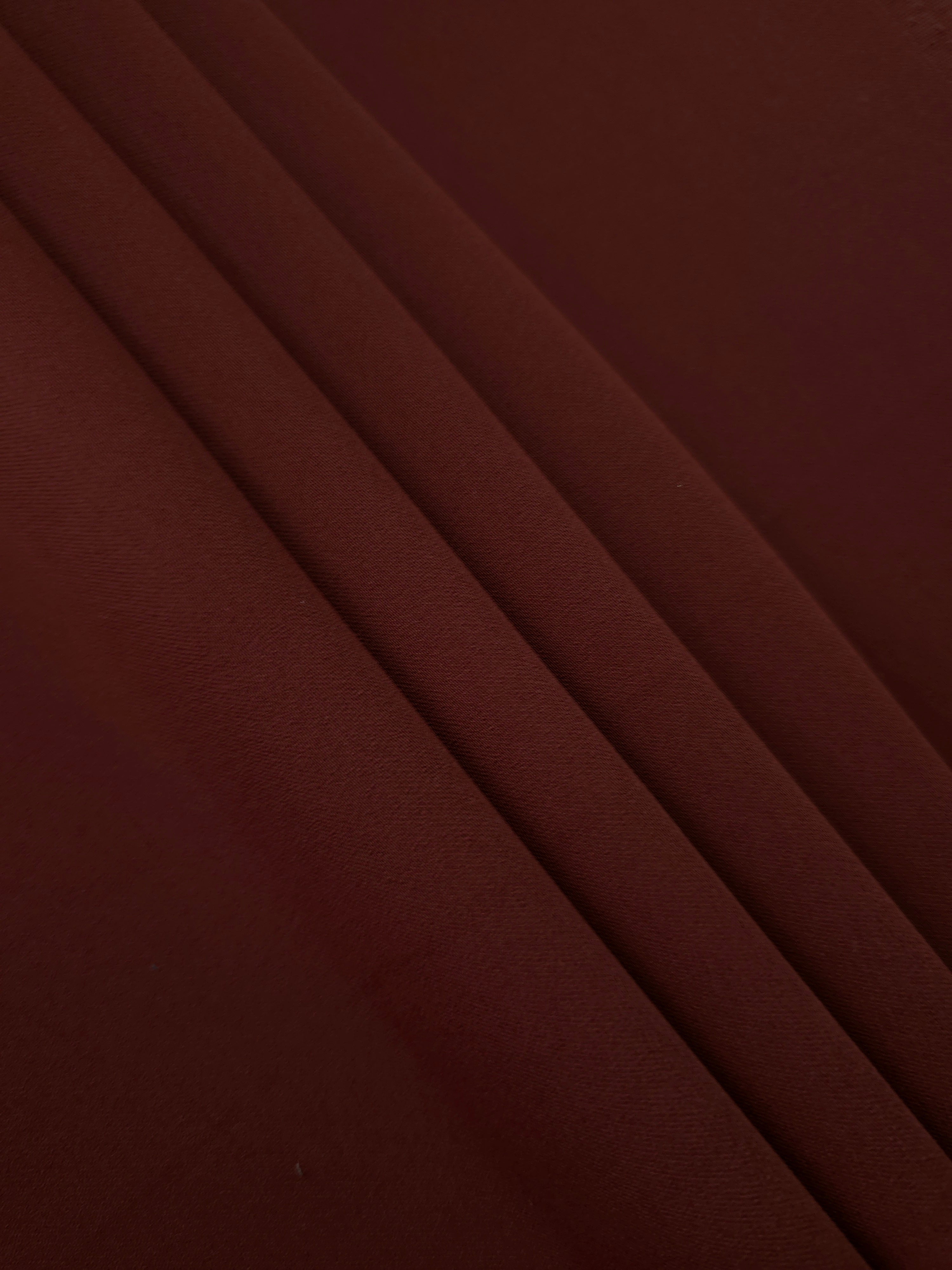 Layered Russet Mahogany Silky Italian Crepe showing soft structure in layered folds, suitable for office blouses, tailored dresses and soft jackets.