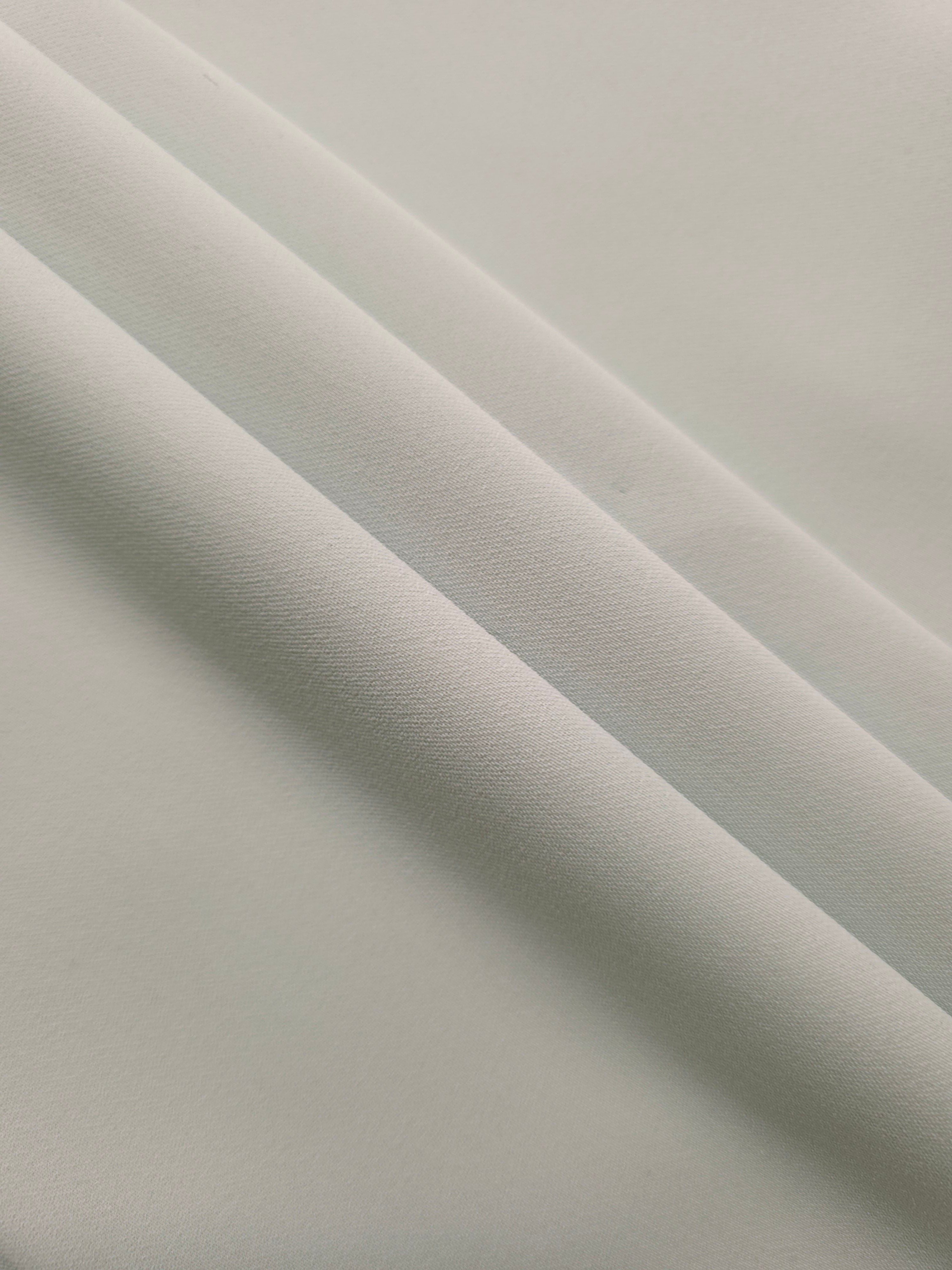 Layered Silver Mist Silky Italian Crepe showing soft structure in layered folds, suitable for abayas, tunics and elegant shirt dresses.