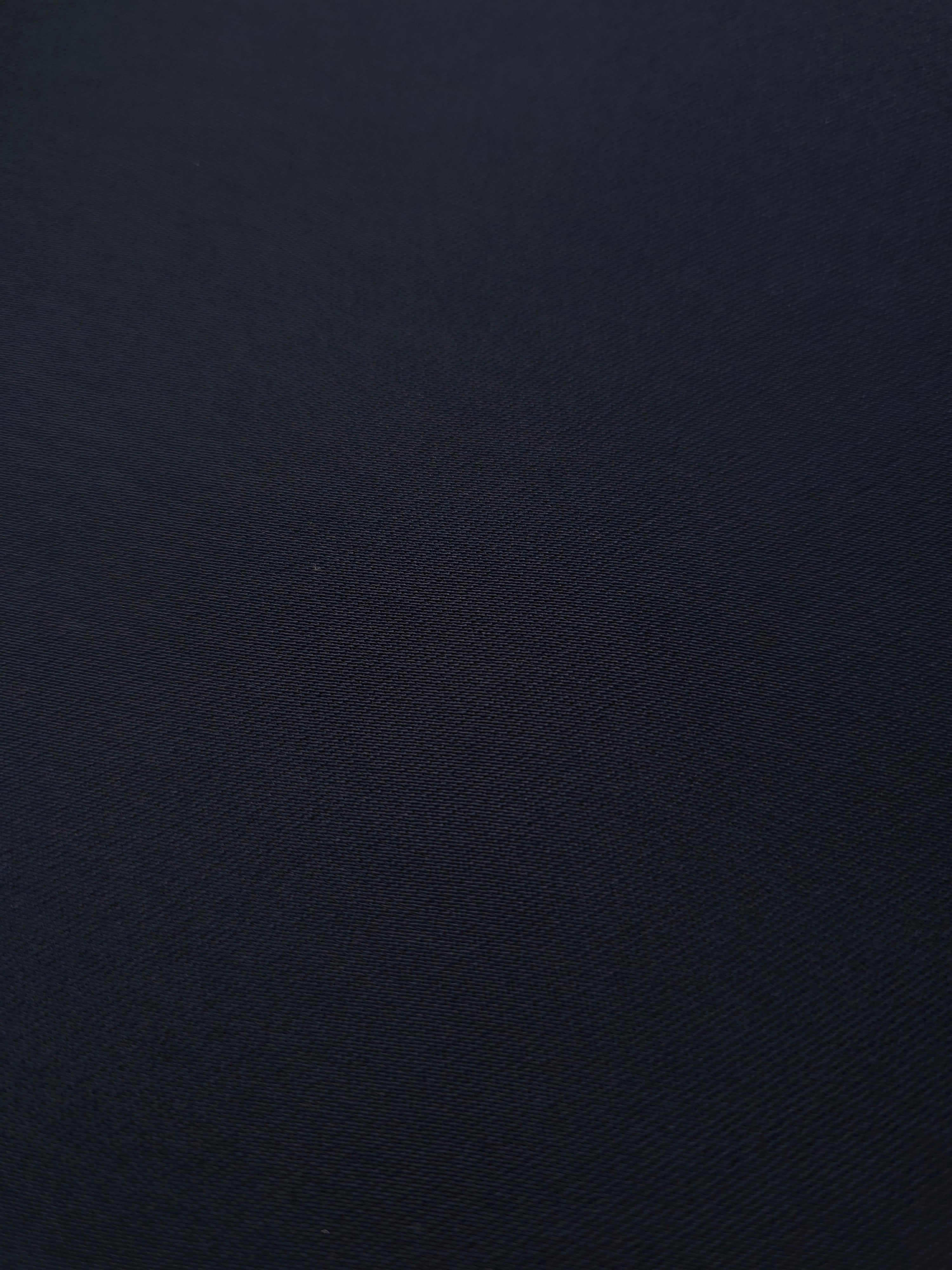 Close-up Storm Navy Silky Italian Crepe showing its fine woven texture and soft hand, ideal for occasion gowns, tunics and lightweight tailored pieces.