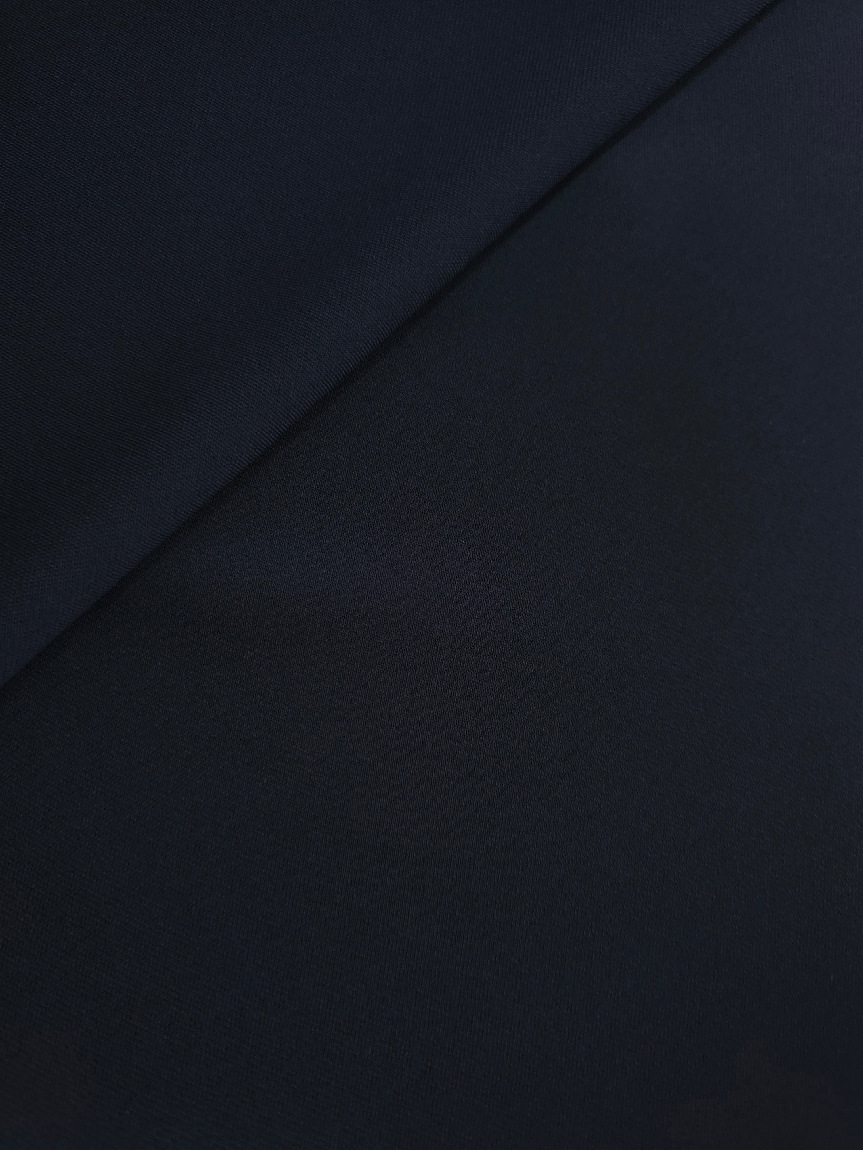 Soft-fold Storm Navy Silky Italian Crepe showing fluid drape through soft folds, suited to blouses, midi skirts and modest dresses.