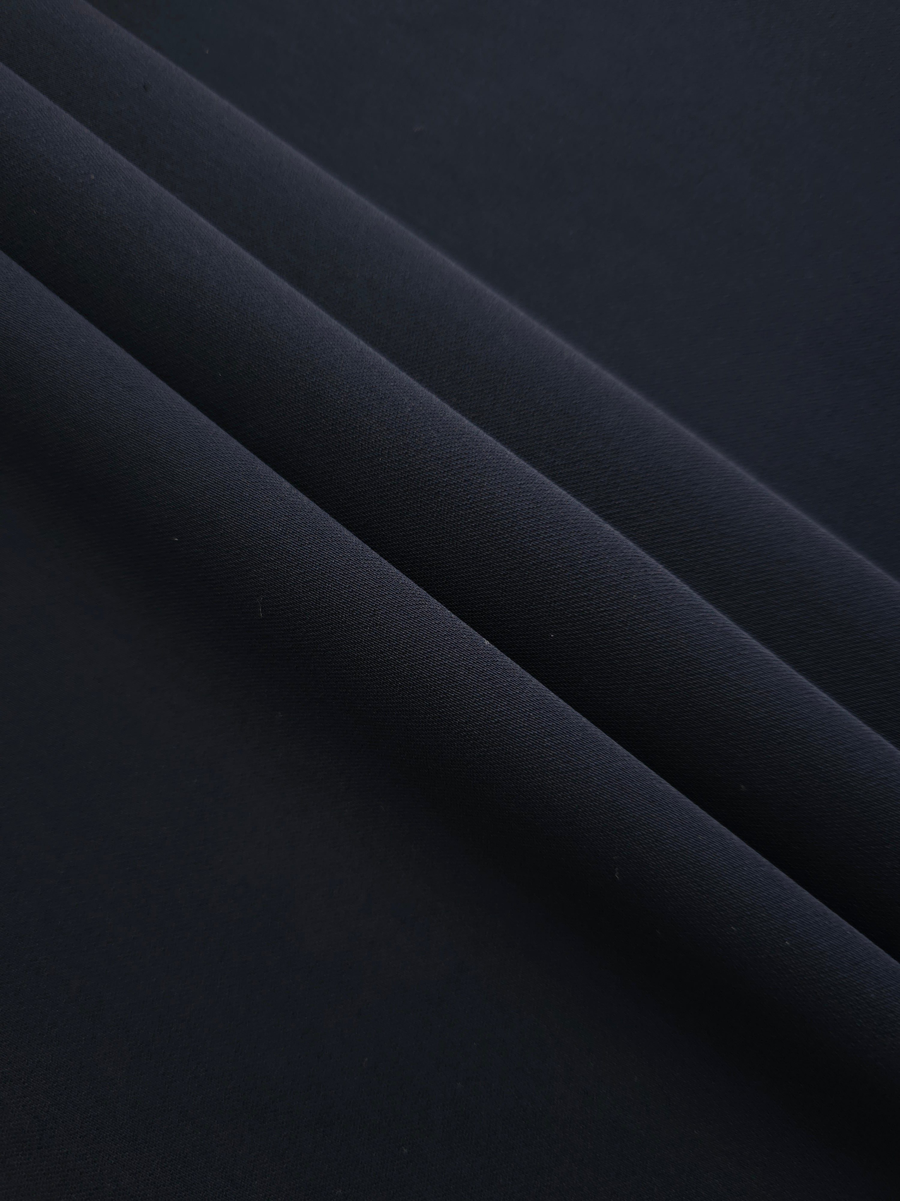 Layered Storm Navy Silky Italian Crepe showing soft structure in layered folds, suitable for maxi dresses, modest sets and lightweight tailoring.