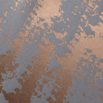 Close-up of the copper and blue-grey animal print, showing the cracked, mottled texture characteristic of this motif