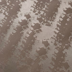 Close detail of the tonal taupe animal print, a quieter option than the higher-contrast colorways