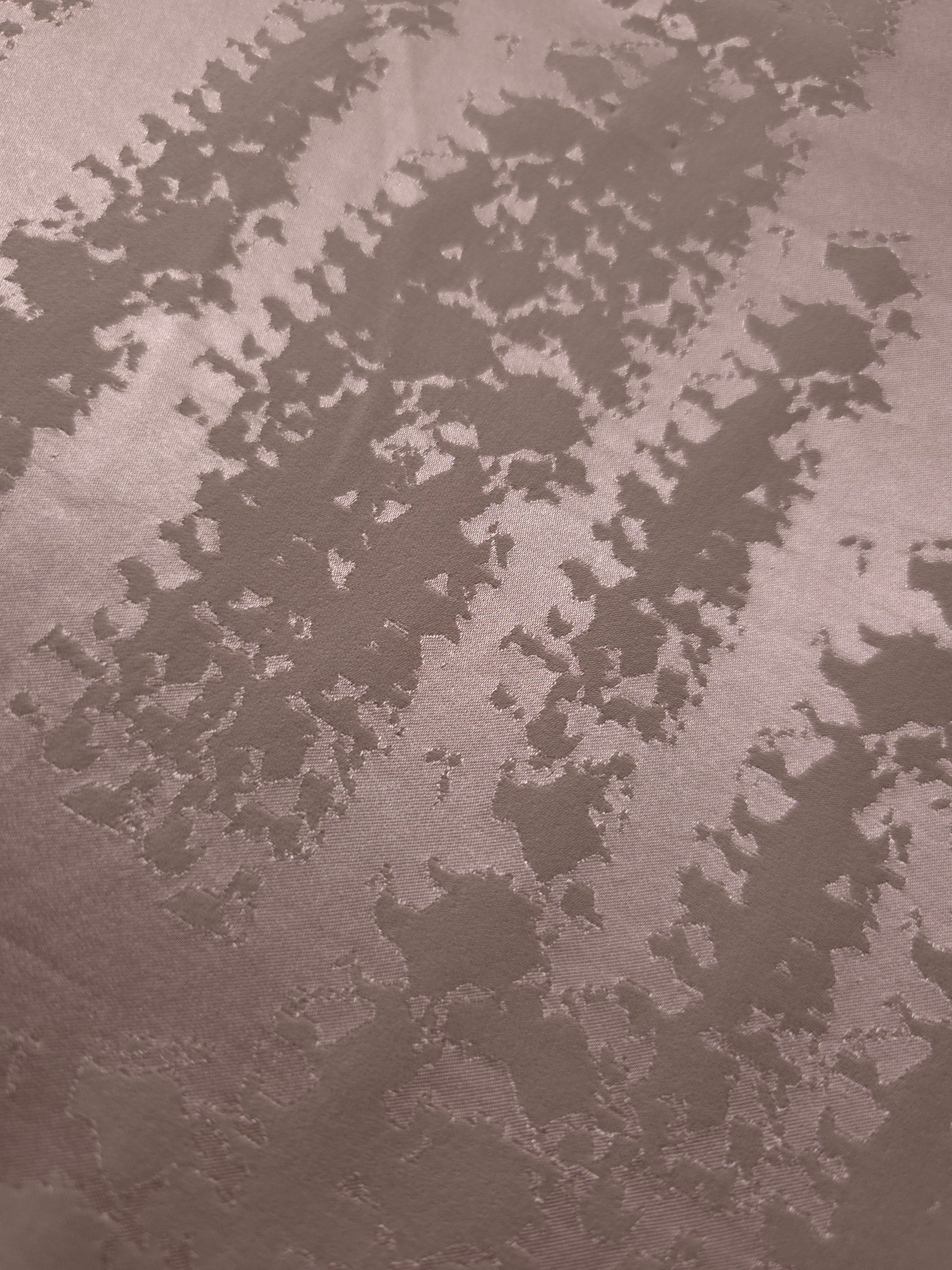 Close detail of the mauve-rose animal print colorway, warmer in tone than the taupe version