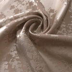 Taupe animal print satin draped loosely, suited to buyers wanting texture without strong color contrast