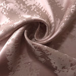Mauve-rose Lassi satin draped to show its fluid movement, the pattern visible mainly through sheen shift