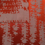 Front and back of the burnt orange colorway, the glossy face far bolder than its muted reverse side