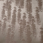 A wider view of the taupe animal print satin laid flat, showing the full tonal pattern repeat