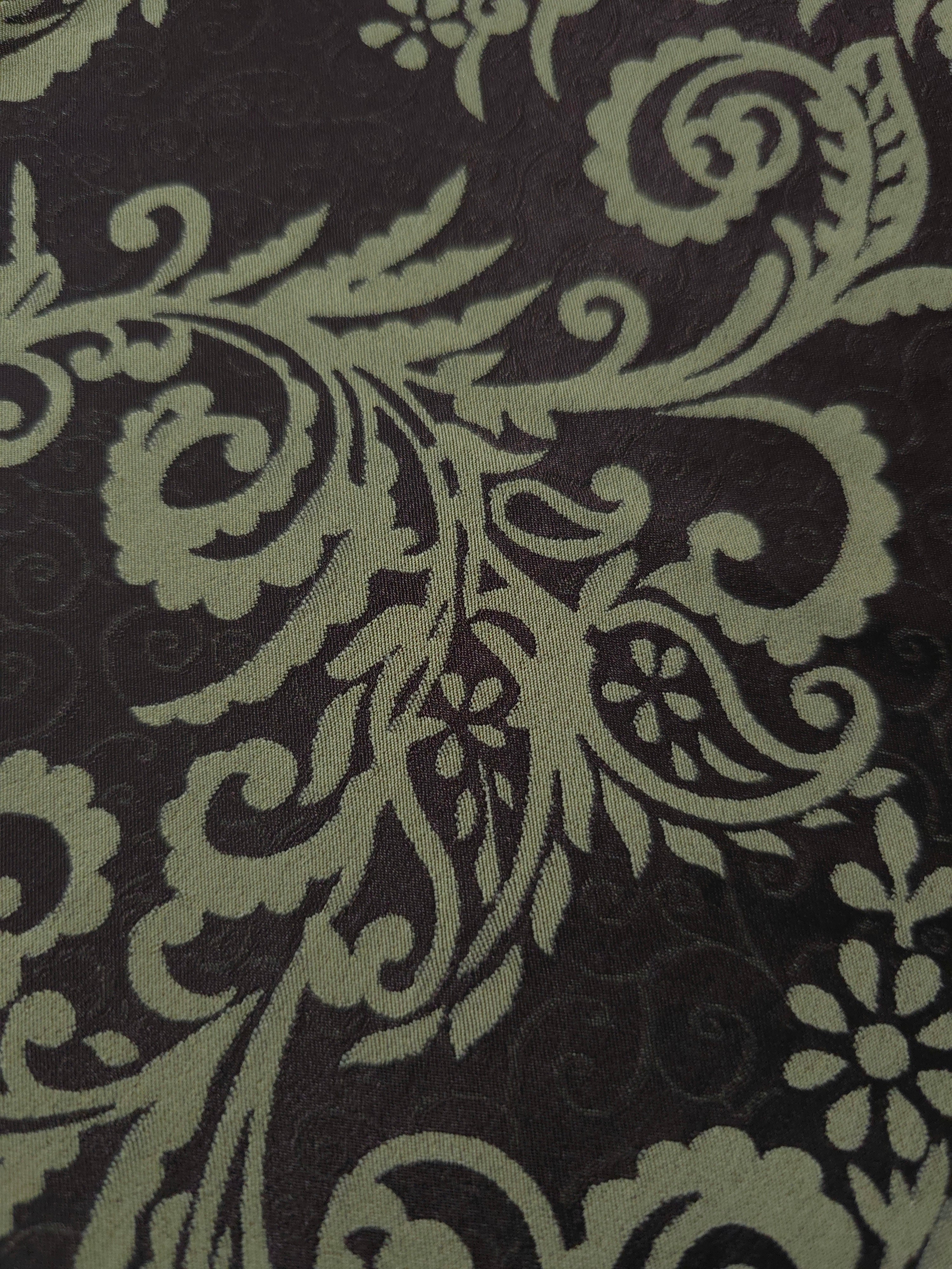 Close-up of the brown and sage baroque colorway, an ornate paisley-scroll motif rather than a floral or geometric one
