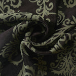 Brown baroque satin draped to catch the light, the ornate sage pattern visible across the fold