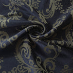 Navy baroque satin draped to show its glossy movement against the olive-khaki scroll pattern