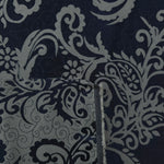 Front and back of the navy and grey colorway, the glossy face holding a deeper blue than its softer reverse