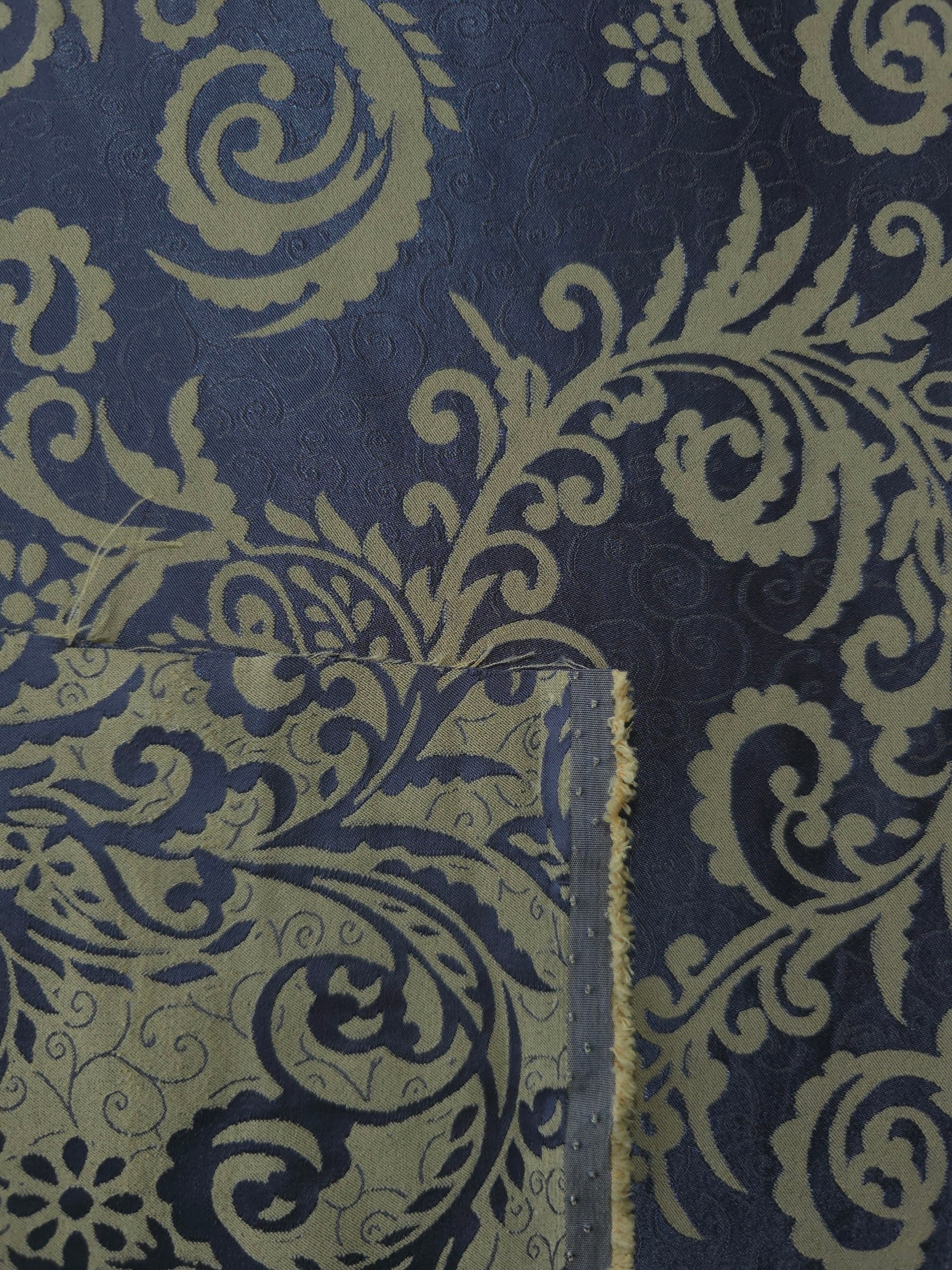Front and back of the navy and olive-khaki colorway, the glossy face holding more warmth than its muted reverse