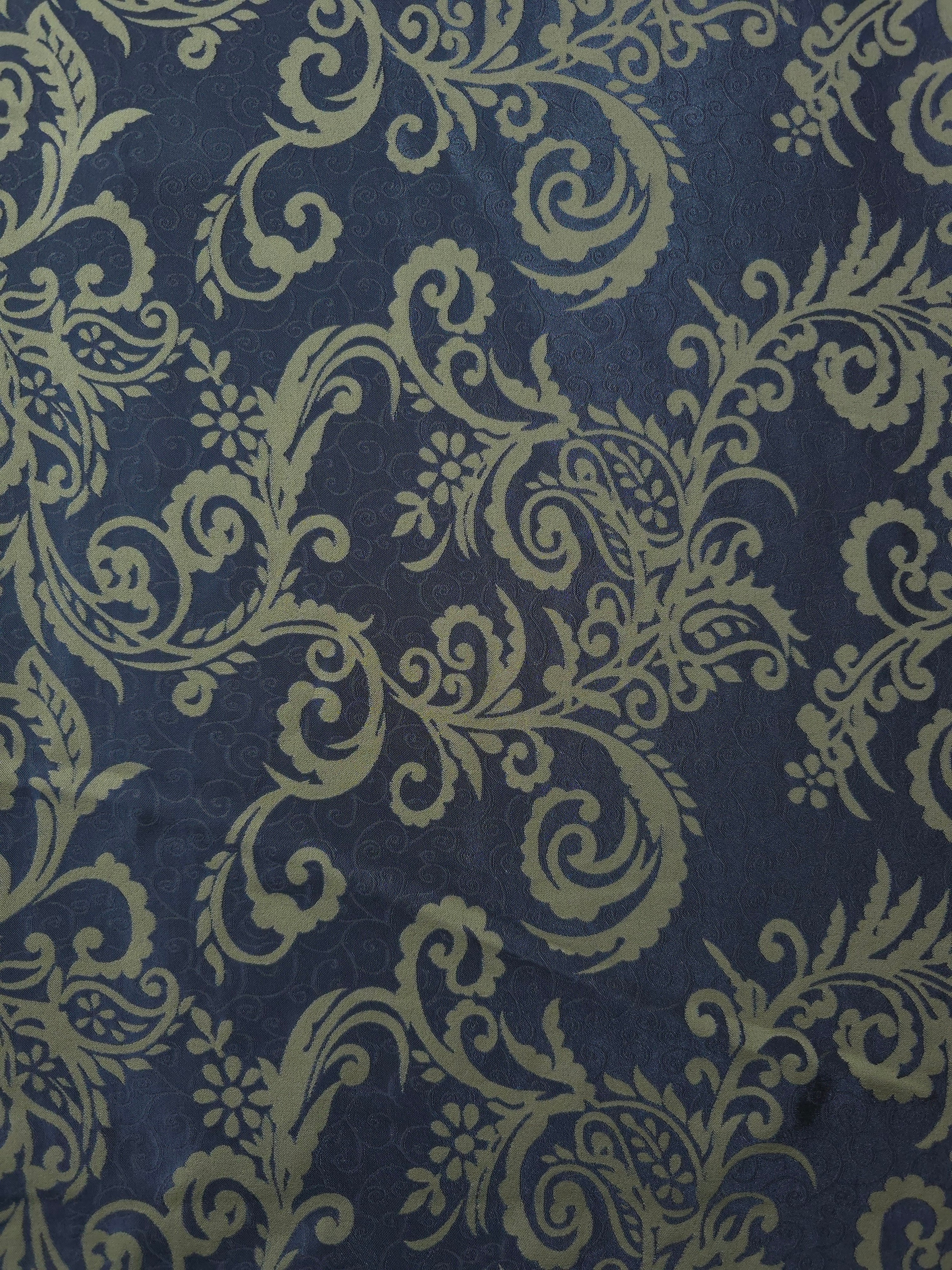 A wider section of the navy and olive-khaki baroque satin, shown to judge the ornate pattern at scale