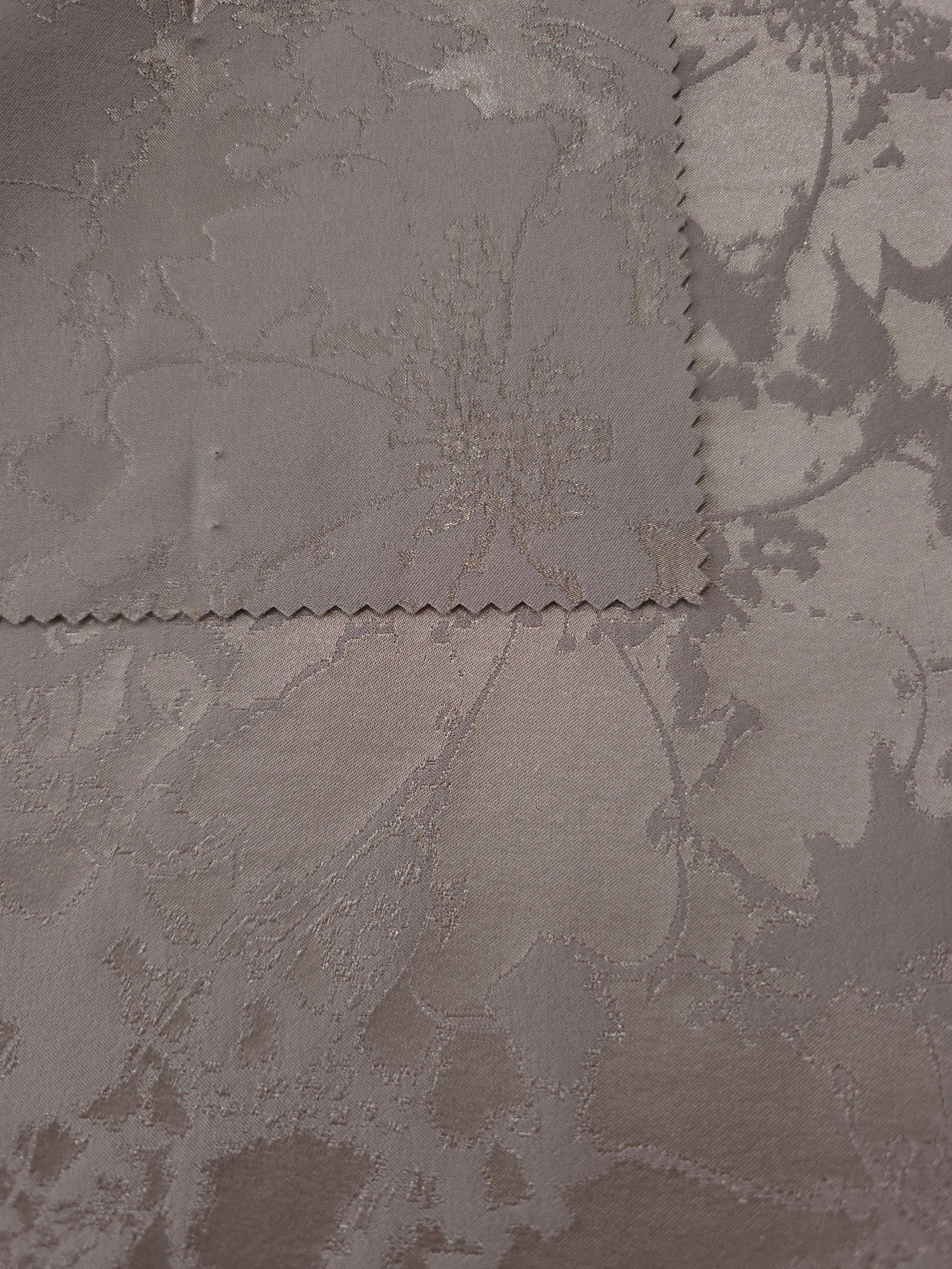 Taupe colorway shown front and back, the reverse side settling into a slightly cooler grey