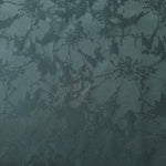 A wider cut of the teal floral satin laid flat, showing the full scale of the spray pattern