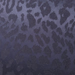 Close-up of leopard metallic jacquard showing pattern-only shimmer on woven fabric.