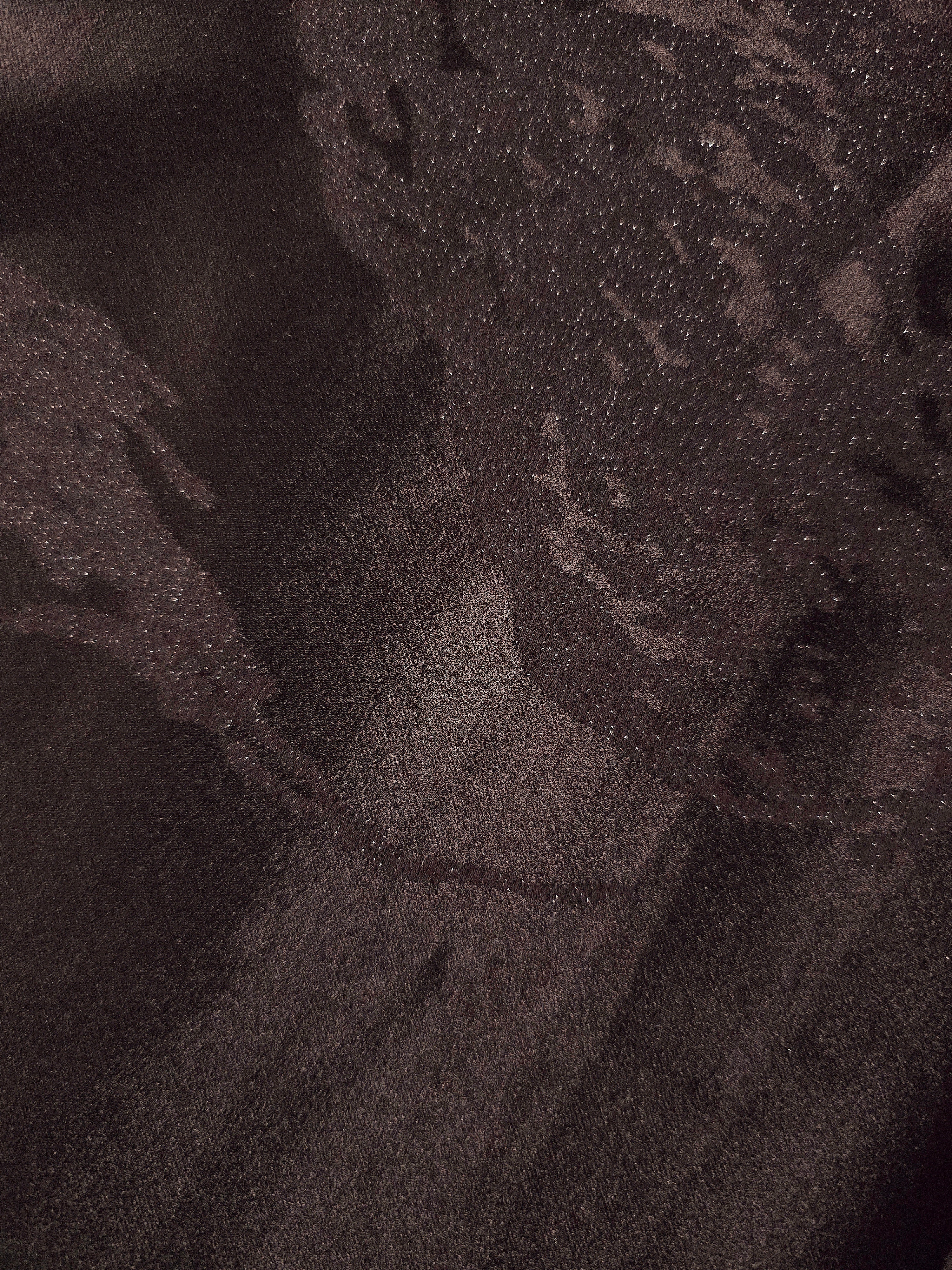 Close-up of dark brown metallic wave jacquard showing pattern-only shine.