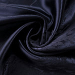 Draped metallic wave motif jacquard with soft movement for dresses and blouses.