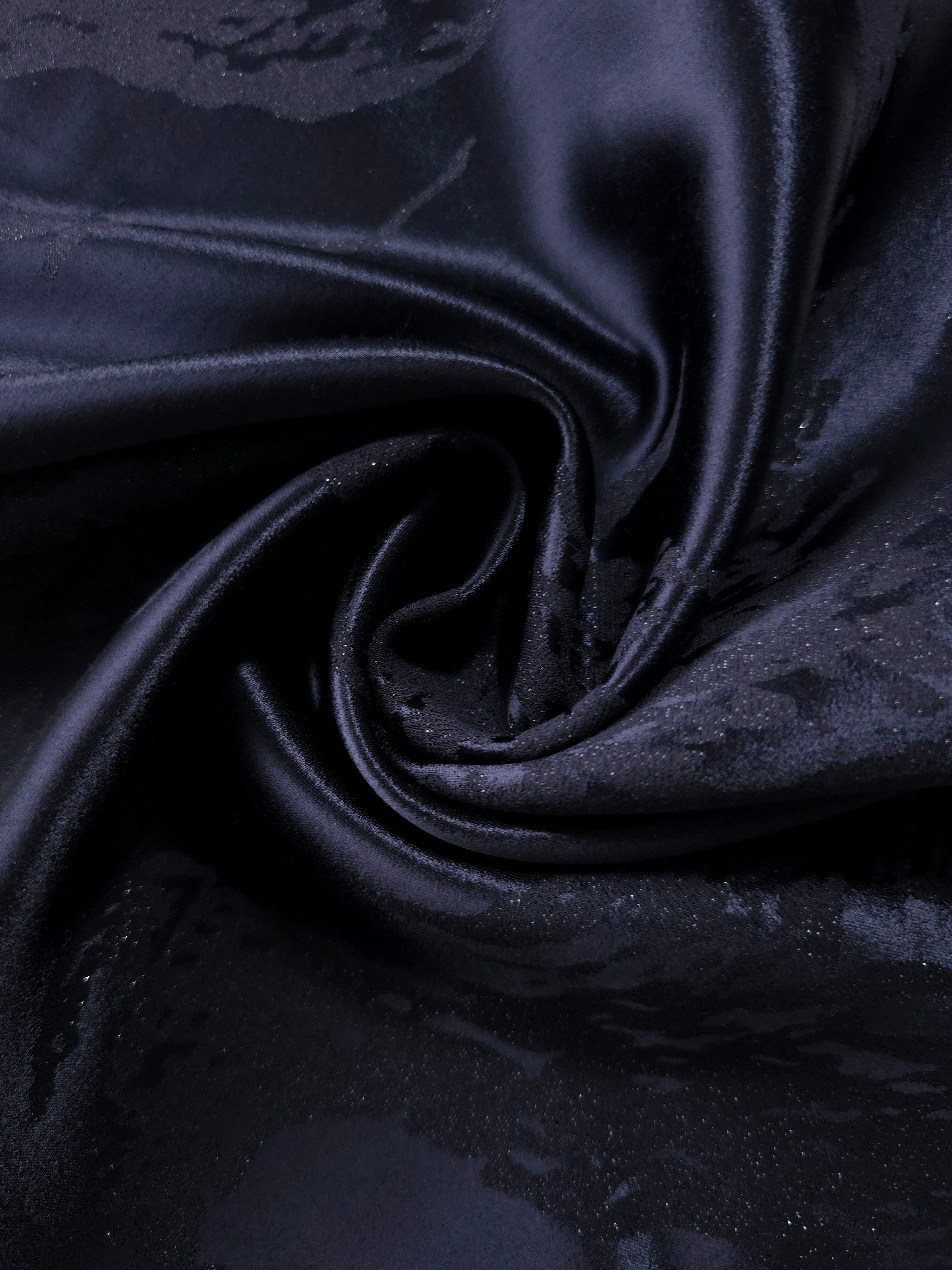 Draped metallic wave motif jacquard with soft movement for dresses and blouses.