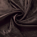 Draped dark brown metallic wave jacquard with soft movement for dresses and skirts.