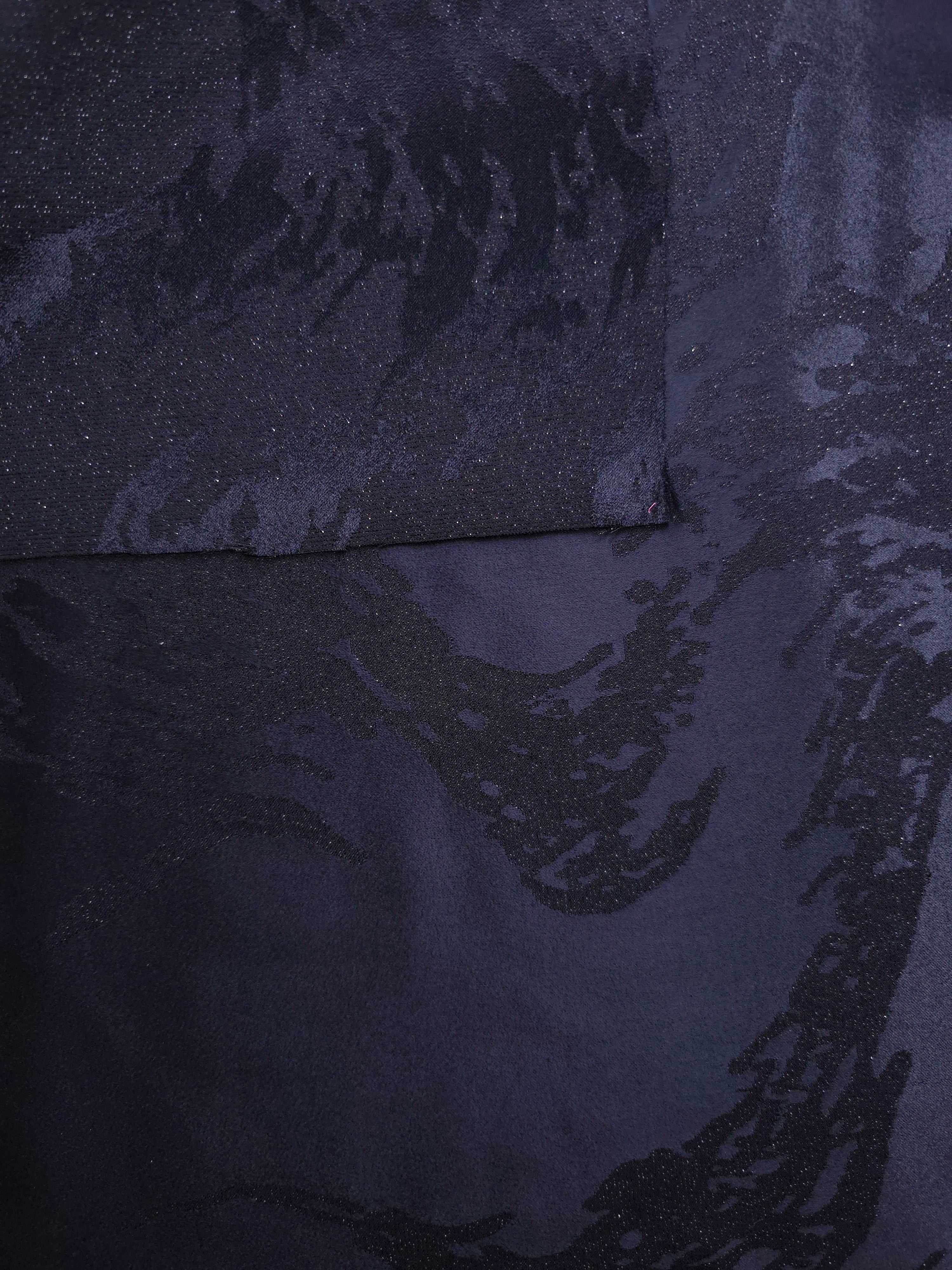 Front and back view of metallic wave jacquard for texture and lining checks.