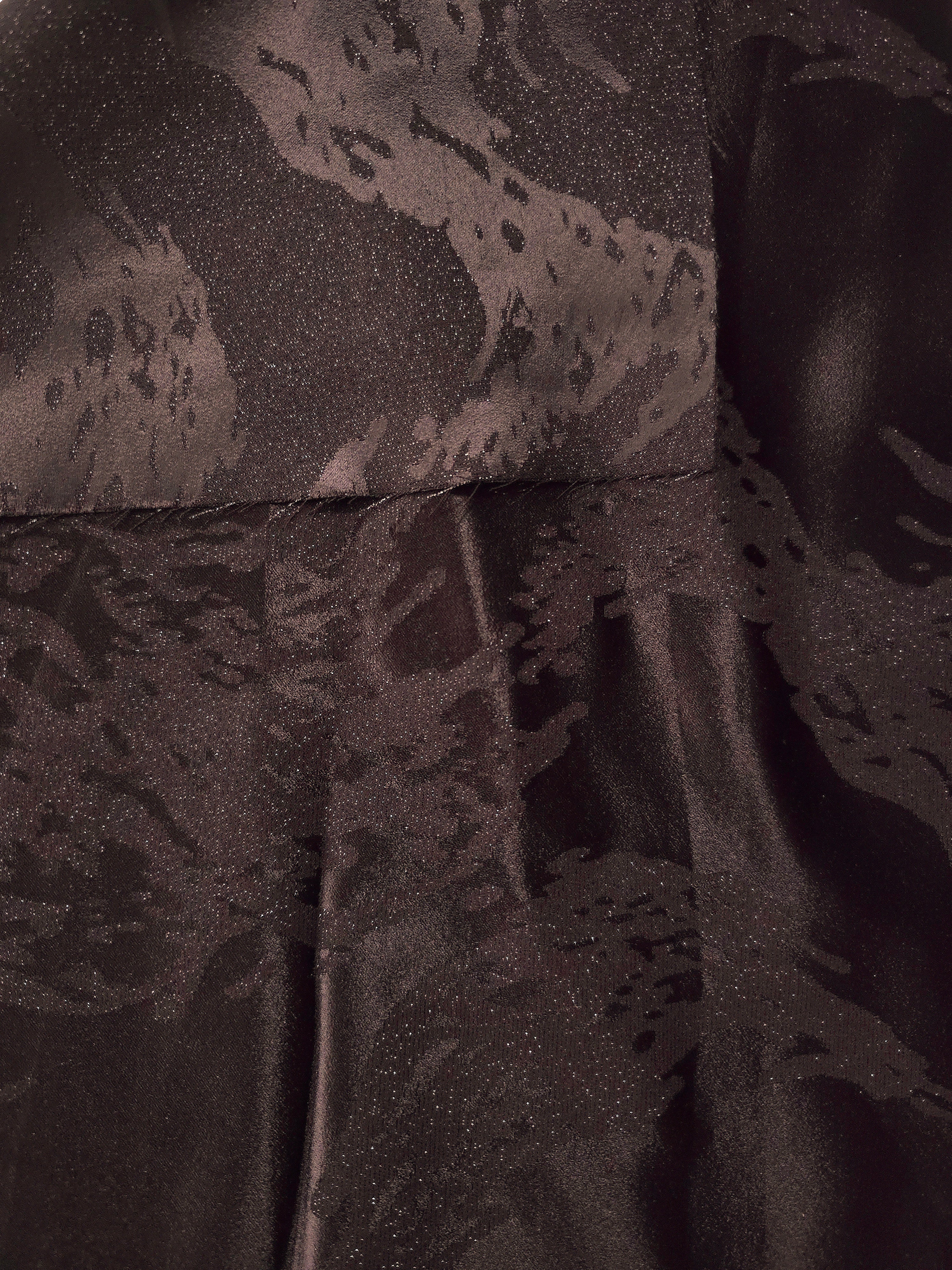 Front and back view of dark brown metallic wave jacquard for lining and texture checks.