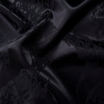 Wave fold of alternate metallic wave jacquard showing raised motif and shine.