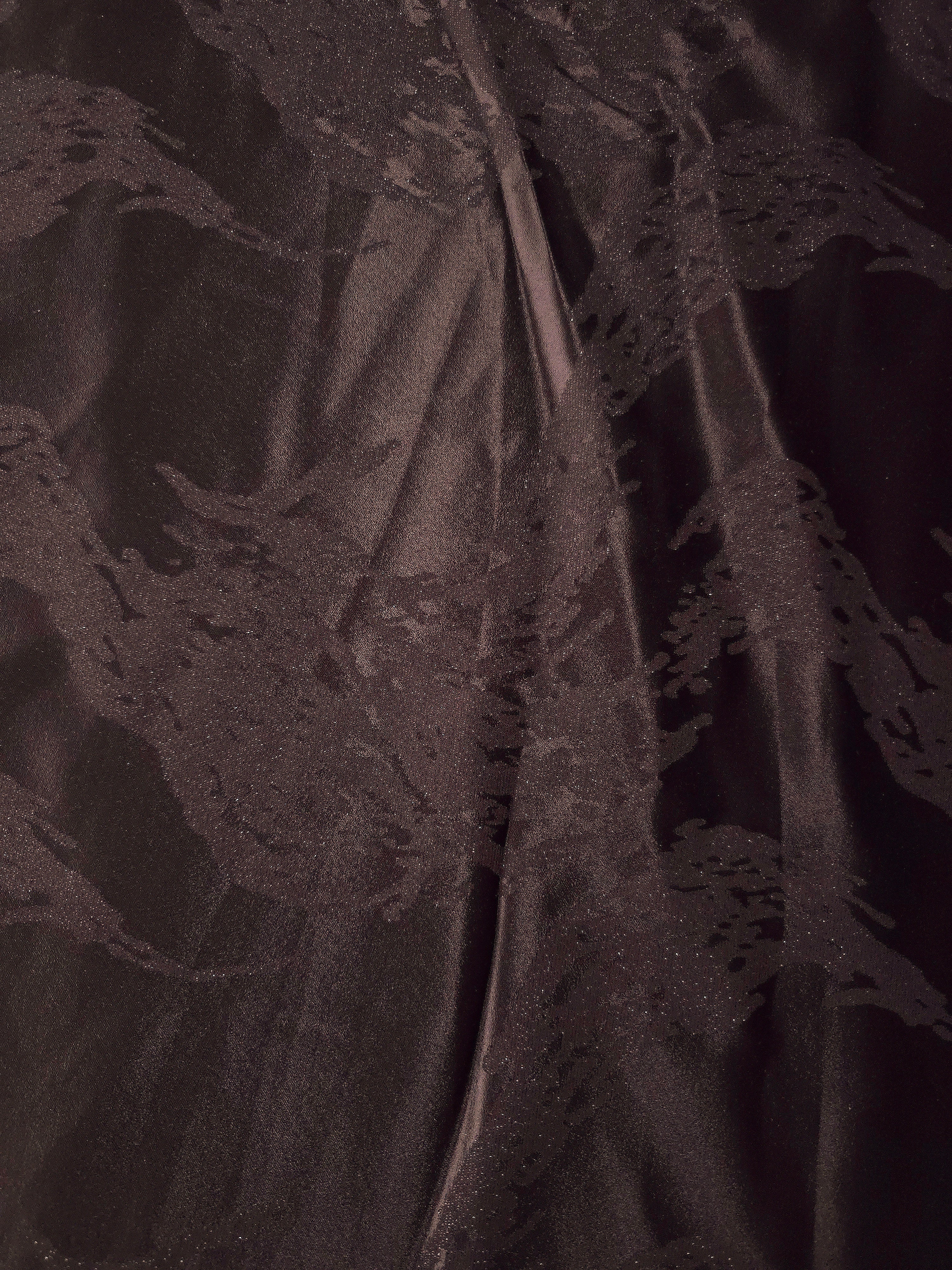 Wide view of dark brown metallic wave motif woven jacquard fabric for dress panels.