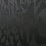 Close-up of zebra metallic jacquard showing pattern-only shimmer on woven fabric.