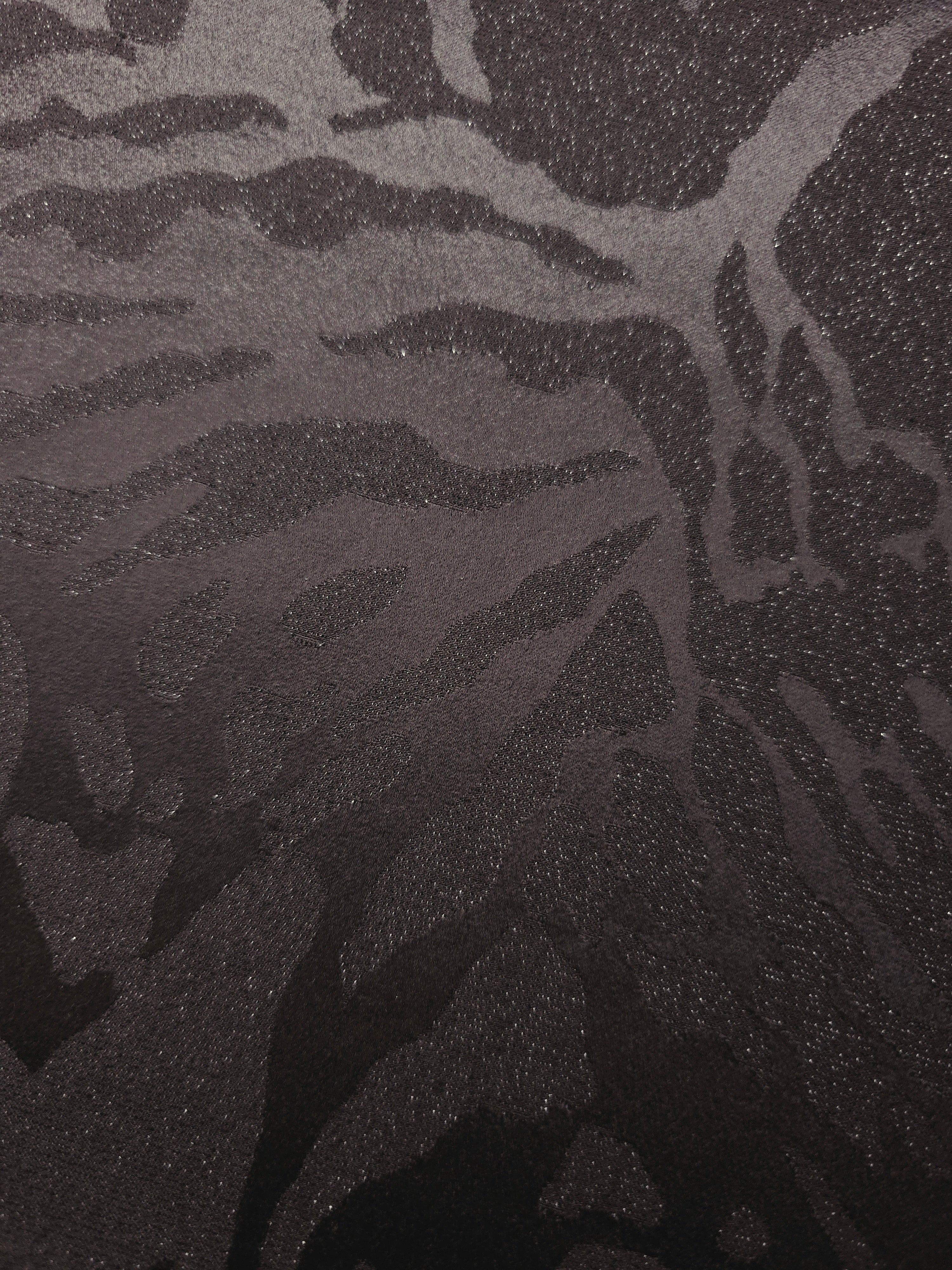 Close-up of second zebra metallic jacquard colourway with raised woven motif.