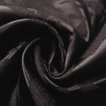 Close drape of second zebra metallic jacquard colourway showing fold detail.