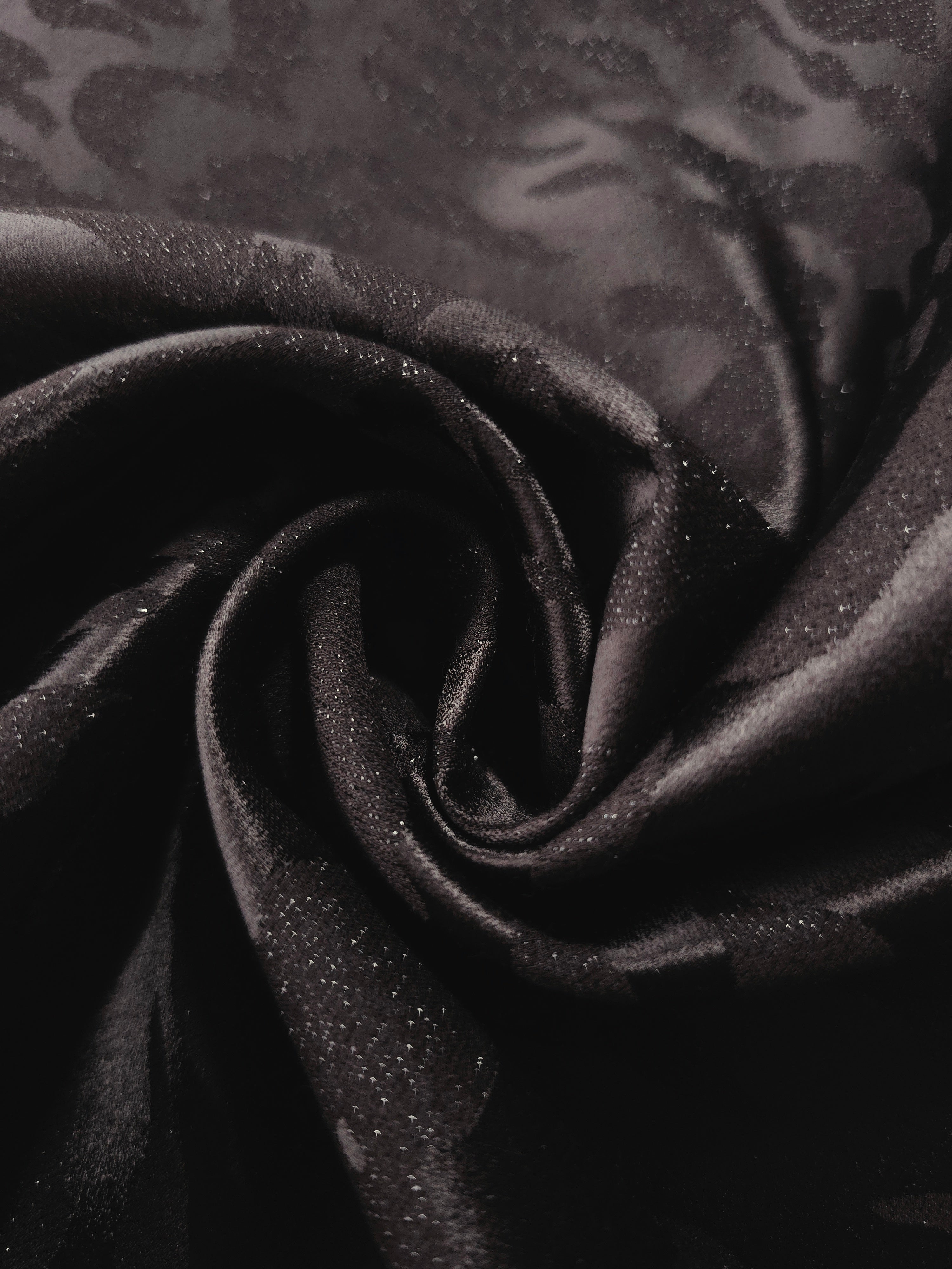 Close drape of second zebra metallic jacquard colourway showing fold detail.