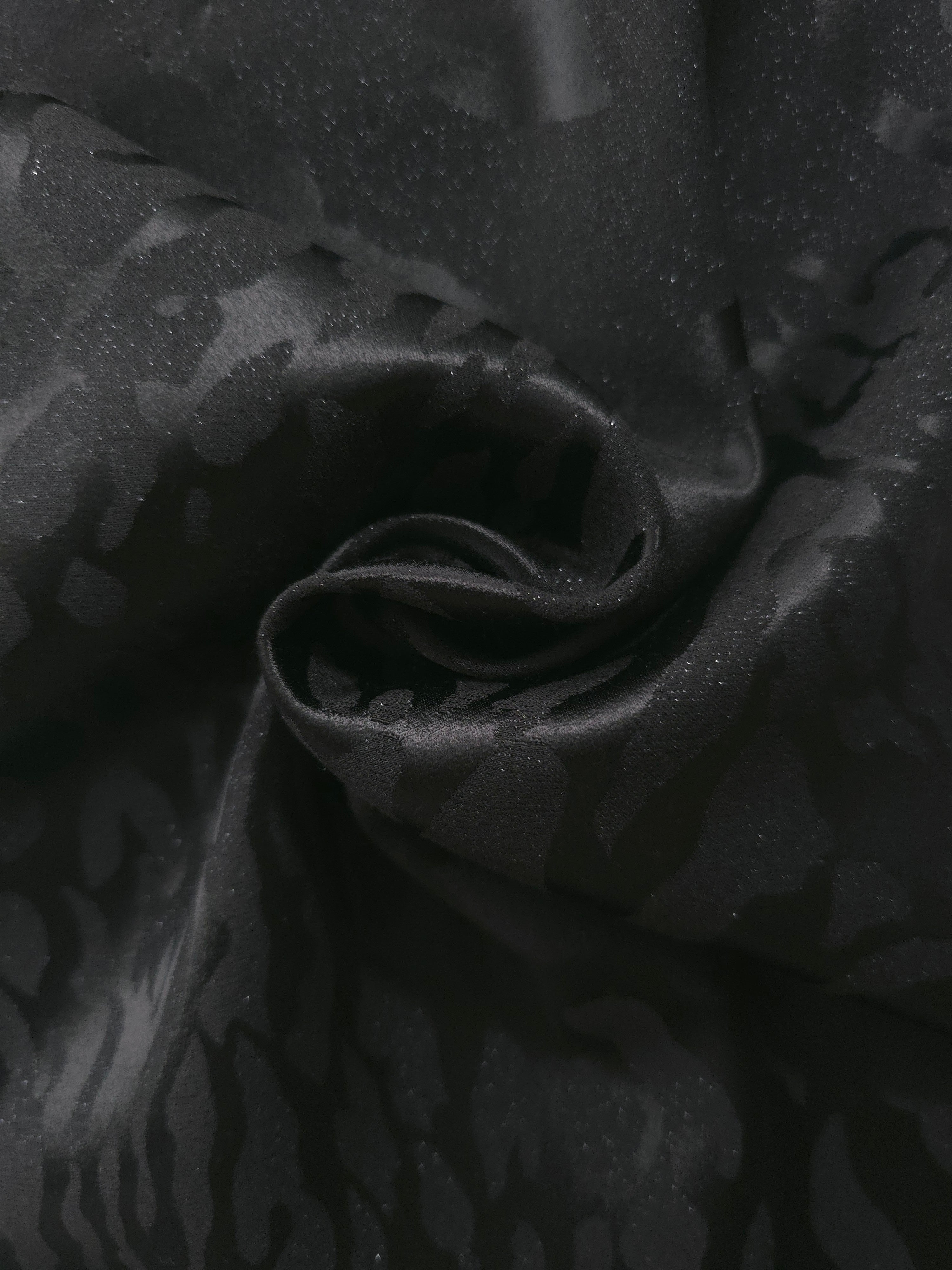 Draped zebra metallic motif woven jacquard with soft movement for skirts and dresses.