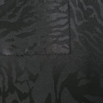 Front and back view of zebra metallic motif jacquard for texture and opacity checks.